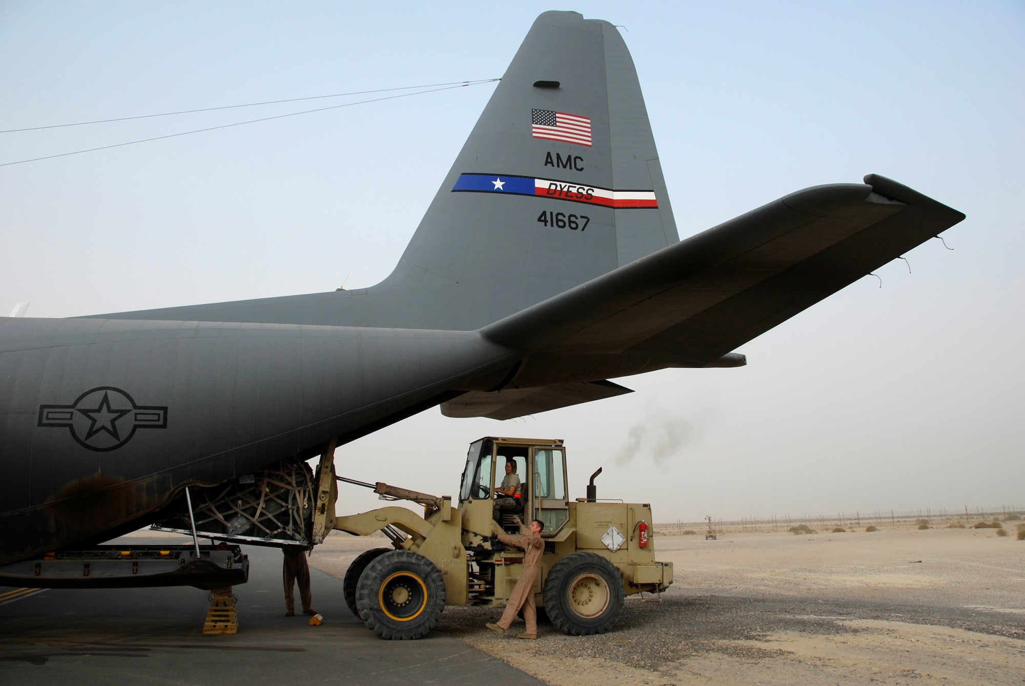 SOUTHWEST ASIA -- Senior Airman Zachary Kelhi, a C-130 Hercules loadmaster deployed to the 737th Expeditionary Airlift Squadron, marshals a 463L cargo pallet onto the aircraft in preparation for the combat sortie that transported Soldiers into Iraq April 21, 2008, from an air base in the Persian Gulf Region. The Air Force recently surpassed more than one million sorties flown by Air Force aircraft in the Global War on Terror since Sept. 11, 2001. Synchronized and integrated into larger coalition air efforts, these missions represent the most deliberate, disciplined and precise air campaign in history. Airman Kelhi is deployed from the 39th Airlift Squadron, Dyess Air Force Base, Texas. (U.S. Air Force photo/ Staff Sgt. Patrick Dixon)