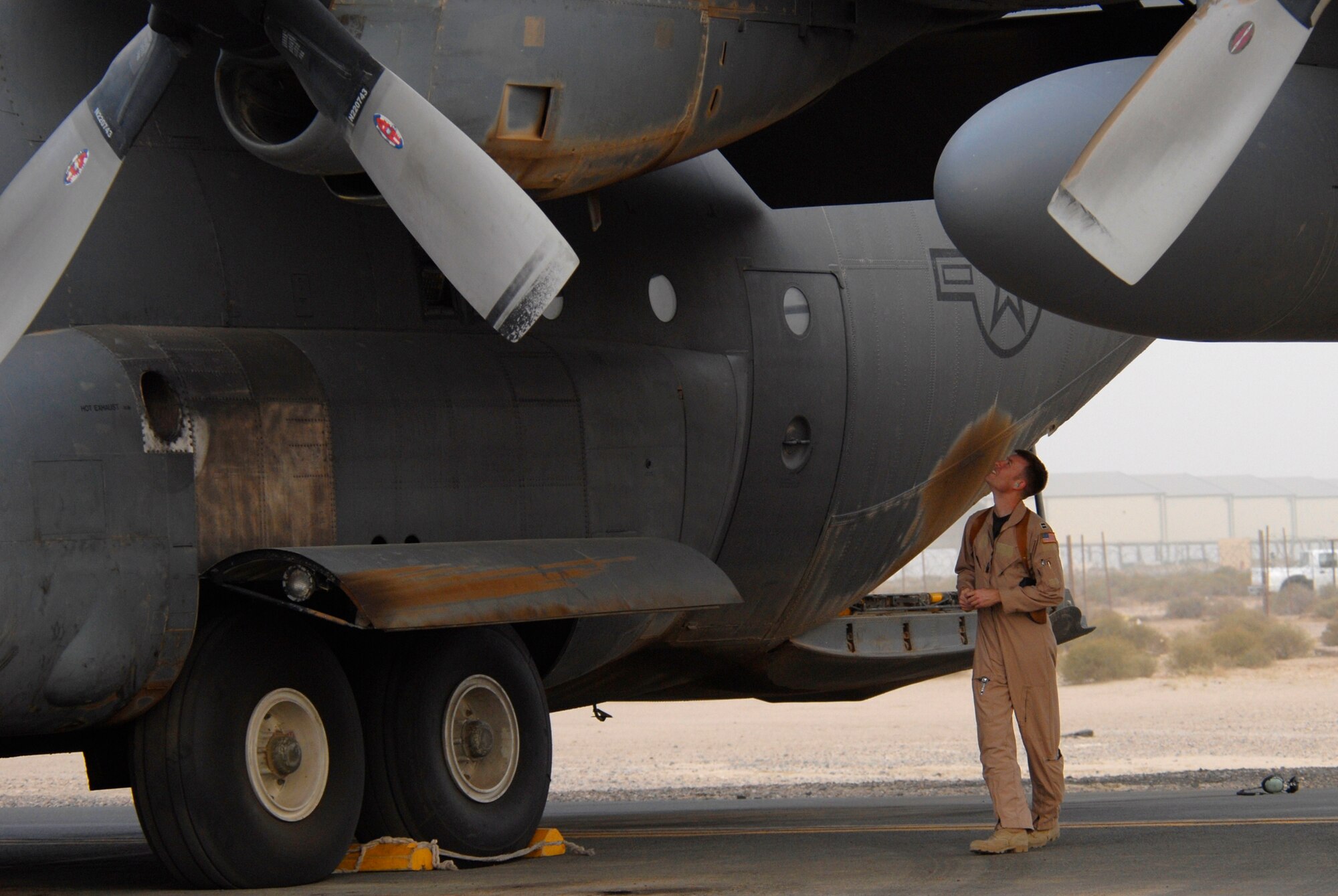SOUTHWEST ASIA -- Captain Thomas Knaust, a C-130 Hercules pilot deployed to the 737th Expeditionary Airlift Squadron, performs a pre-flight walk around on a C-130 Hercules prior to the take-off of a combat sortie that transported Soldiers into Iraq April 21, 2008, from an air base in the Persian Gulf Region. The Air Force recently surpassed more than one million sorties flown by Air Force aircraft in the Global War on Terror since Sept. 11, 2001. Synchronized and integrated into larger coalition air efforts, these missions represent the most deliberate, disciplined and precise air campaign in history. Captain Knaust is deployed from the 317th Operations Support Squadron, Dyess Air Force Base, Texas. (U.S. Air Force photo/ Staff Sgt. Patrick Dixon)