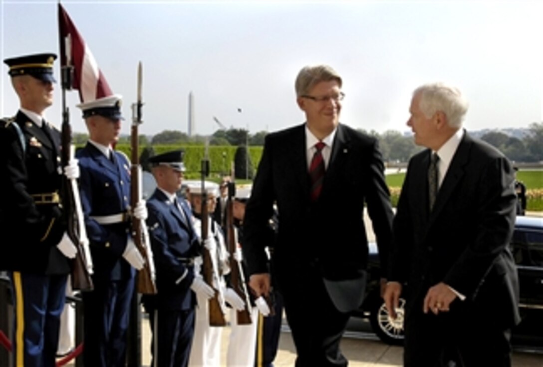 Defense Secretary Robert M. Gates, right, escorts Latvian President Valdis Zalters, left, through an honor cordon upon his arrival at the Pentagon for bilateral defense meetings, April 24, 2008.  