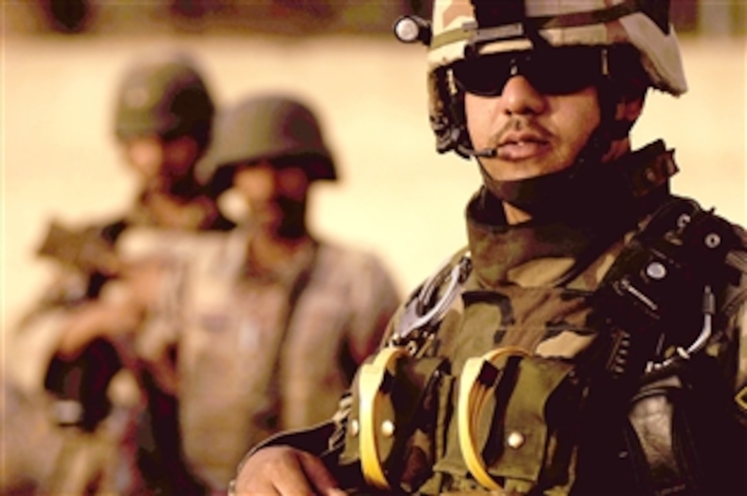 An Iraqi army soldier prepares to go on a dismounted patrol to secure the streets in the Tharwa 1 neighborhood in the southern portion of Baghdad's Sadr City district, April 14, 2008.