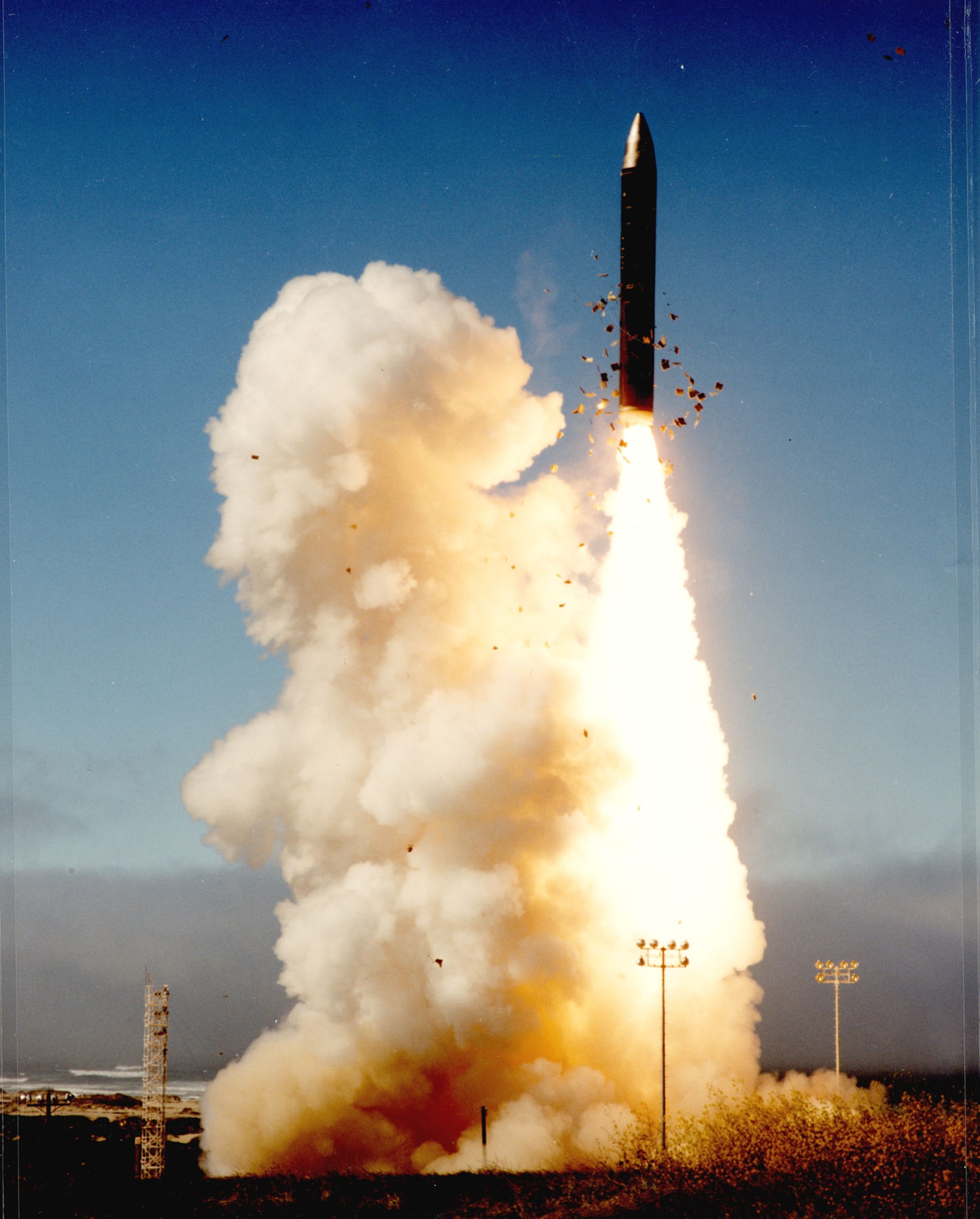 The LGM-118A’s first stage solid rocket ignites as the missile clears the silo. (U.S. Air Force photo)