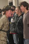 CAMP RIPLEY, Minn.- Sgt. Bobi M. Severyn, a drill instructor with 4th Battalion, , Marine Corps Recruit Depot Paris Island, S.C., shows a poolee just how loud he needs to sounds off during RS Twin Cities' Annual Mini-Boot Camp April 25-27. Photo by Staff Sgt. Stephen L. Traynham, Recruiting Station Twin Cities