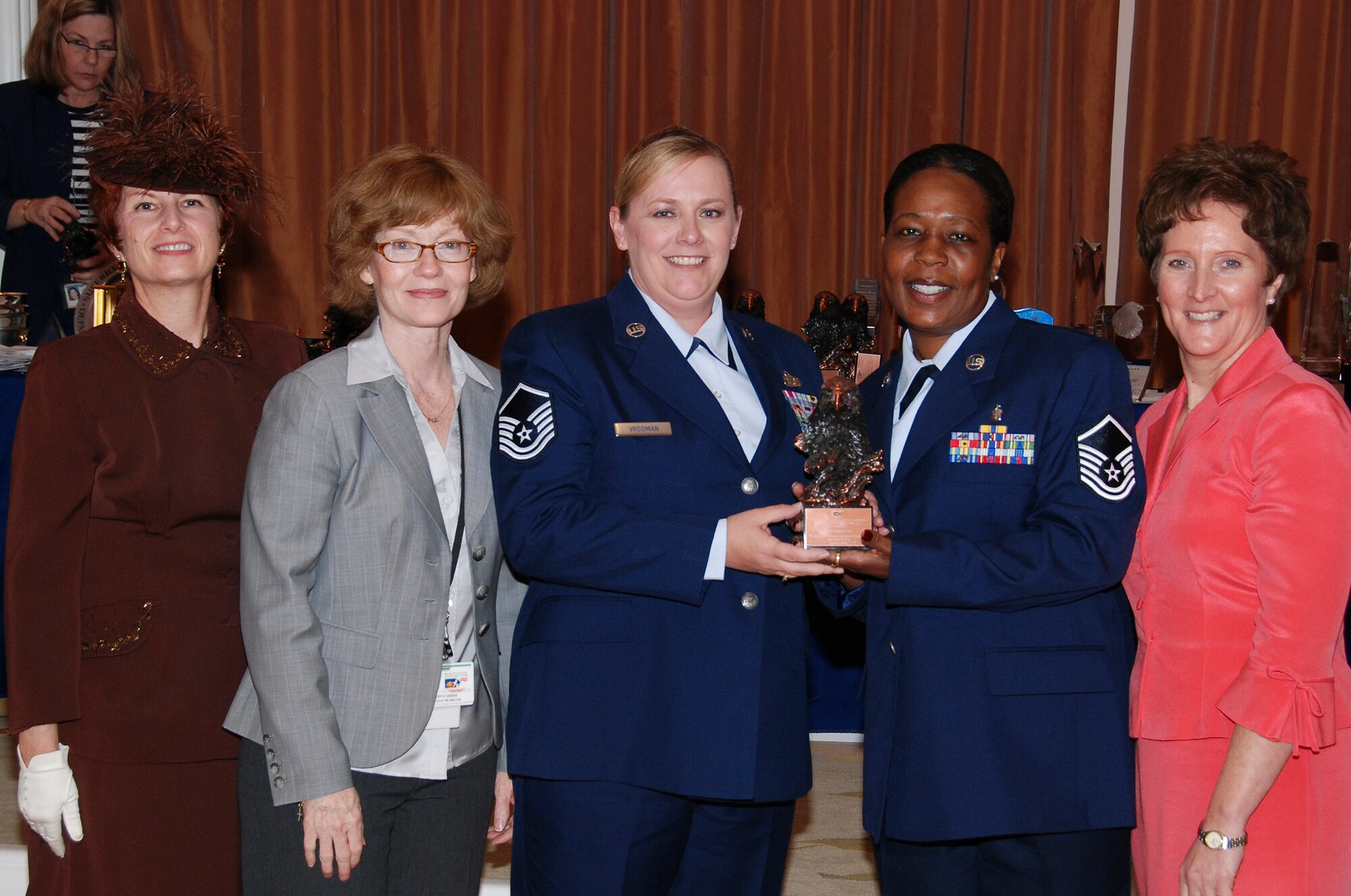 Recently, Los Angeles Air Force Base was the recipient of an award from the Los Angeles VA Hospital honoring base personnel for their volunteer efforts at the hospital. Master Sgt. Lori Vrooman and Master Sgt. December Garner accepted the award on behalf of the base at the hospital’s annual luncheon, April 17. (Photo by Paula Berger, Los Angeles VA Hospital)