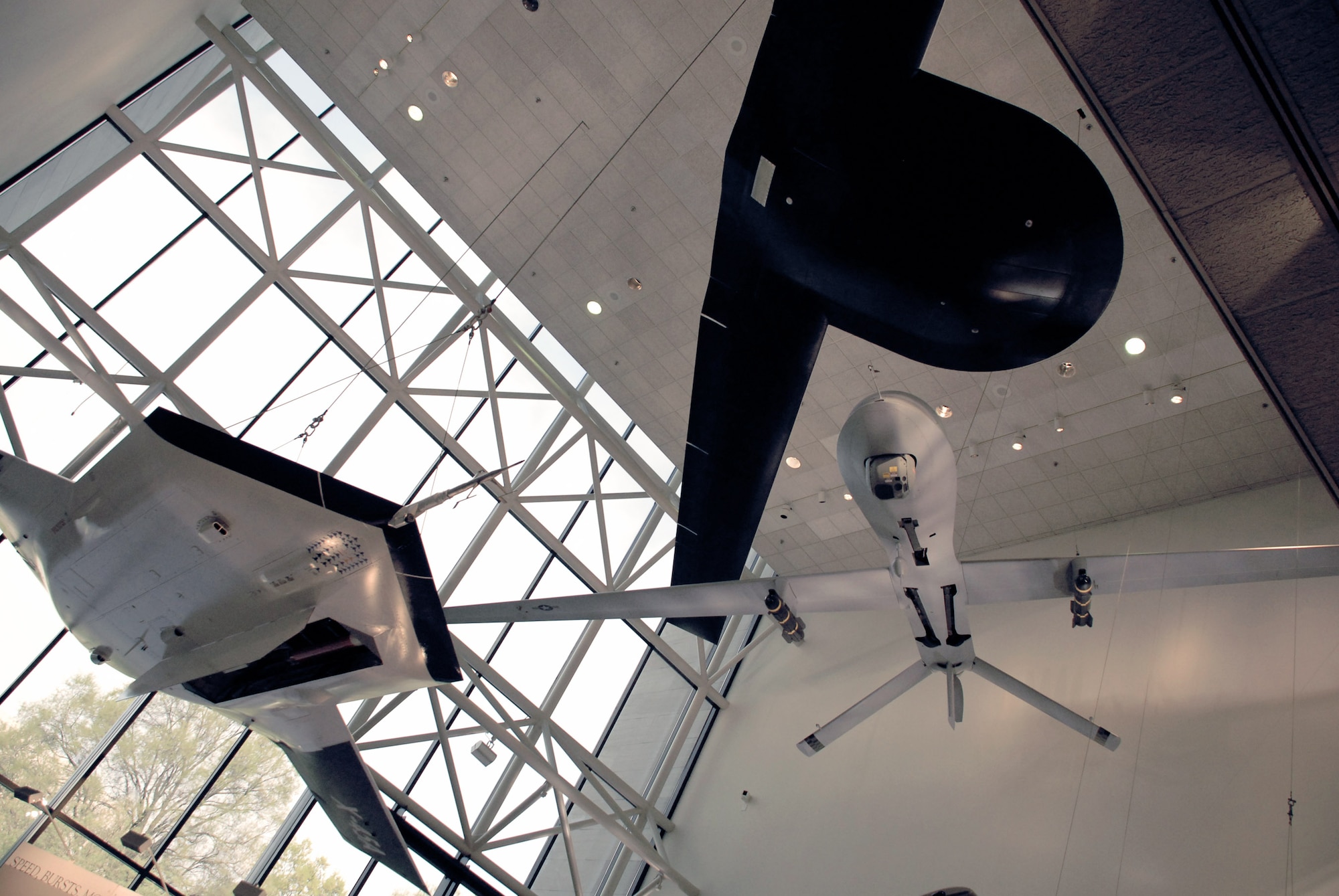 An RQ-3A Darkstar (top), MQ-1L Predator A (right) and X-45A Joint Unmanned Combat Air System (left) hang in the Smithsonian Institution's National Air and Space Museum in a new exhibit of military unmanned aerial vehicles. The exhibit, which opened to the public April 24, includes six UAVs from all four services and will be on display for the next 10 years.  (U.S. Air Force photo/Staff Sgt. J.G. Buzanowski)