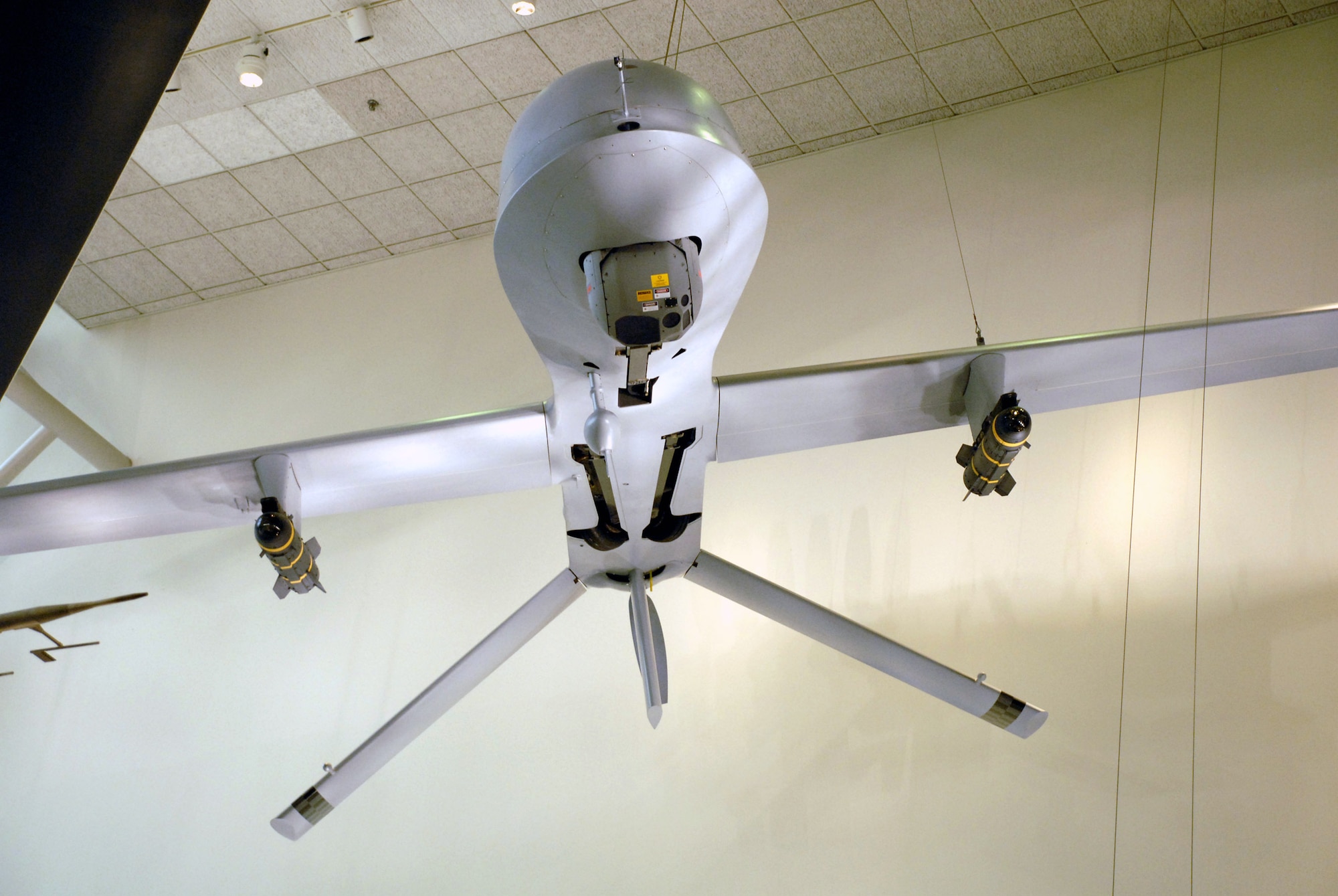 An MQ-1L Predator A hangs in the Smithsonian Institution's National Air and Space Museum in a new exhibit of military unmanned aerial vehicles.  The exhibit, which opened to the public April 24, includes six UAVs from all four services and will be on display for the next 10 years.  This particular Predator was the first MQ-1L to fire a missile in combat and flew 196 combat missions before being retired. (U.S. Air Force photo/Staff Sgt. J.G. Buzanowski) 