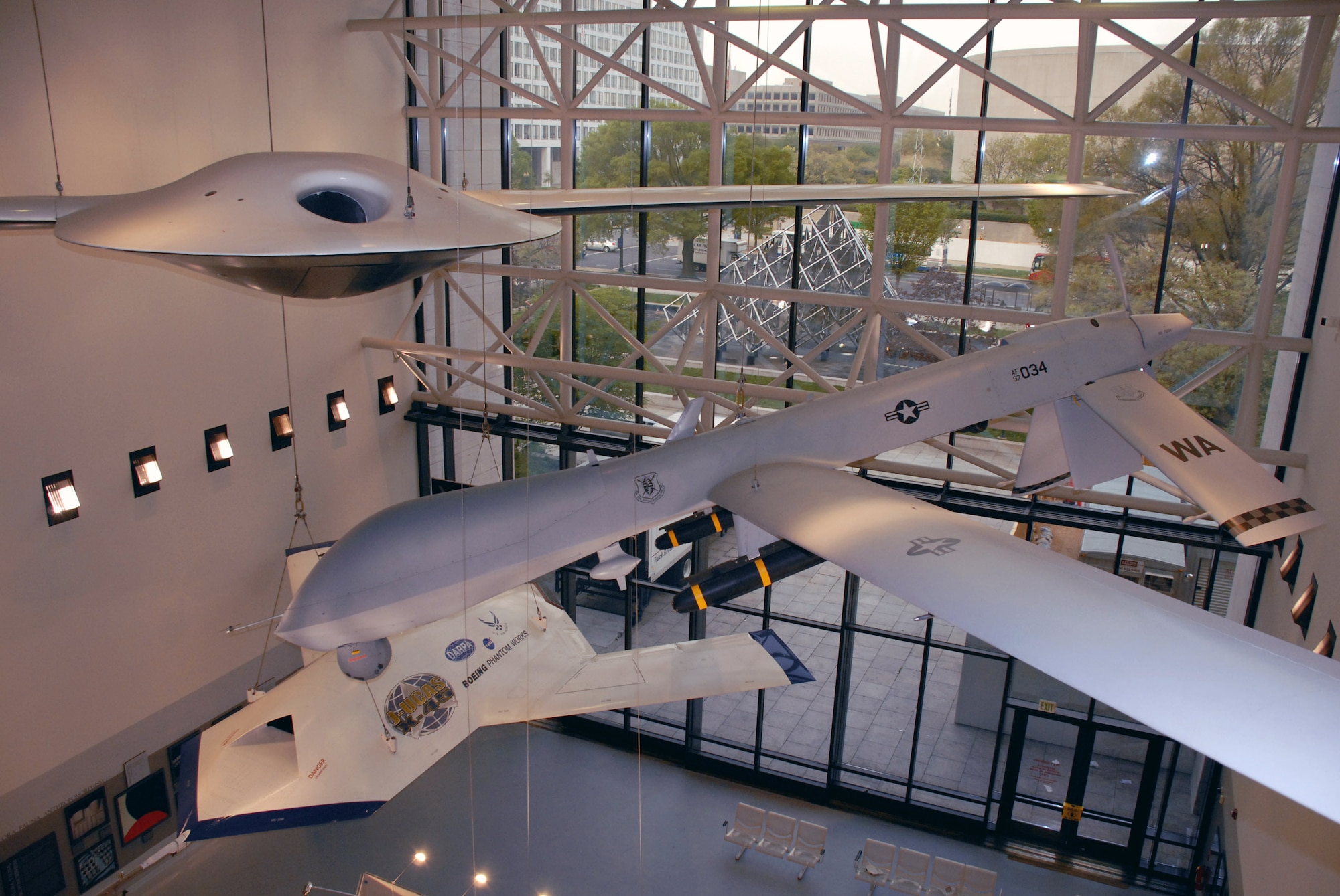 An RQ-3A Darkstar (top to bottom), MQ-1L Predator A and X-45A Joint Unmanned Combat Air System hang in the Smithsonian Institution's National Air and Space Museum in a new exhibit of military unmanned aerial vehicles. The exhibit, which opened to the public April 24, includes six UAVs from all four services and will be on display for the next 10 years.  (U.S. Air Force photo/Staff Sgt. J.G. Buzanowski) 