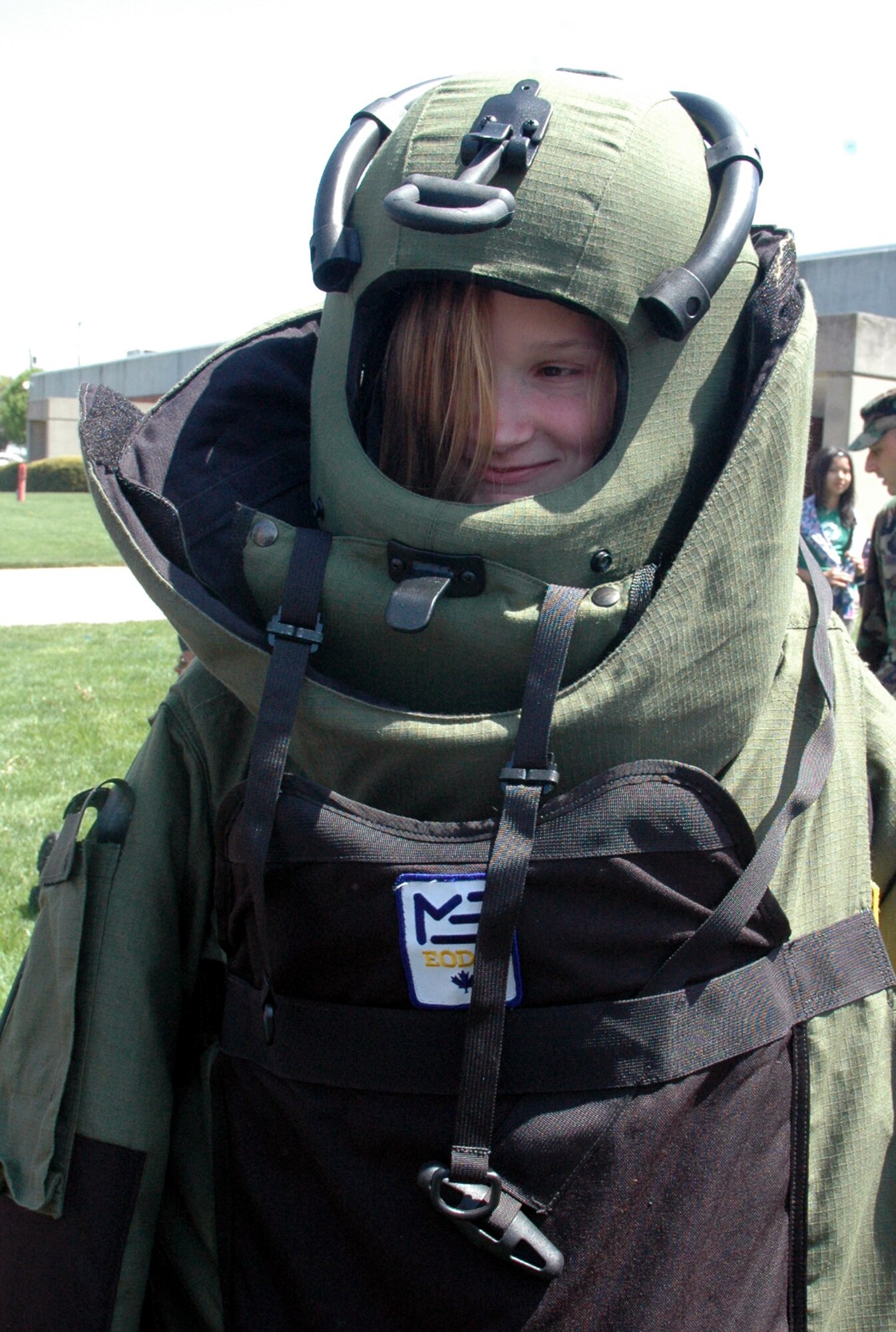 Macy Sturkol, daughter of Tech. Sgt. Scott and Mrs. Bobbi Sturkol, tries on a bomb suit used by explosive ordnance disposal Airmen as part of a demonstration event for "Take Your Children to Work Day" at the Center on Fort Dix April 24, 2008.  More than 70 children participated in the event. (U.S. Air Force Photo/Tech. Sgt. Scott T. Sturkol)