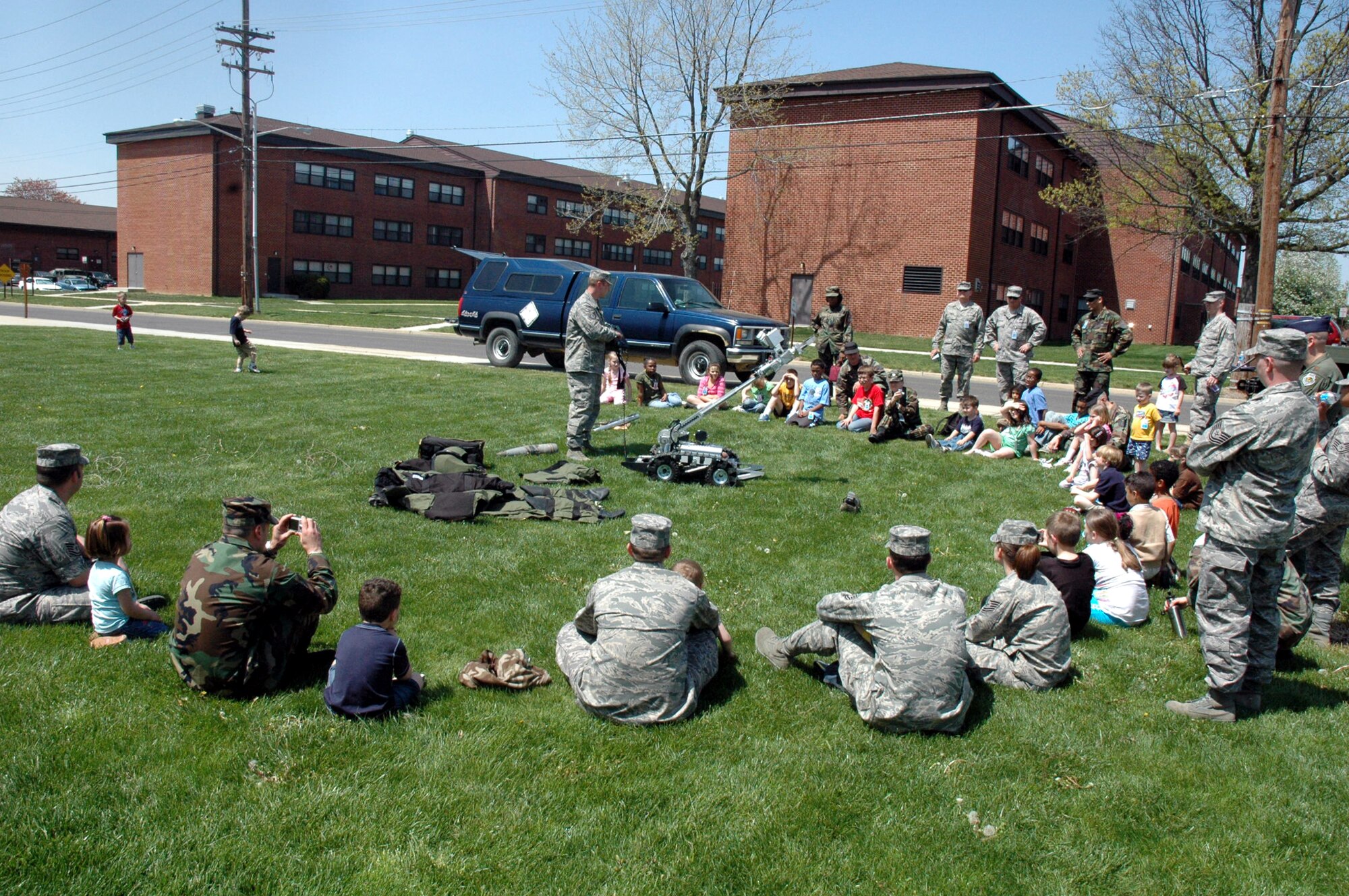 Tech. Sgt. Vandiver Hood, from the U.S. Air Force Expeditionary Center's 421st Combat Training Squadron, shows USAF EC Airmen and their children some of the equipment by explosive ordnance disposal Airmen as part of a demonstration event for "Take Your Children to Work Day" at the Center on Fort Dix April 24, 2008.  More than 70 children participated in the event. (U.S. Air Force Photo/Tech. Sgt. Scott T. Sturkol)
