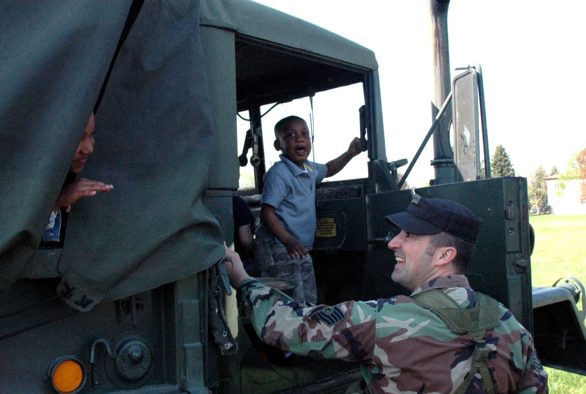 Tech. Sgt. Sean Graves, from the U.S. Air Force Expeditionary Center's 421st Combat Training Squadron at Fort Dix, N.J., shows children at the McGuire Air Force Base, N.J., child development center the inside of a military truck April 24, 2008, at McGuire.  The demonstration was part of an effort by the 421st CTS who sent several Airmen to the CDCs at McGuire and Fort Dix for a tactical vehicle display and demonstration.  (U.S. Air Force Photo/Tech. Sgt. Scott T. Sturkol)