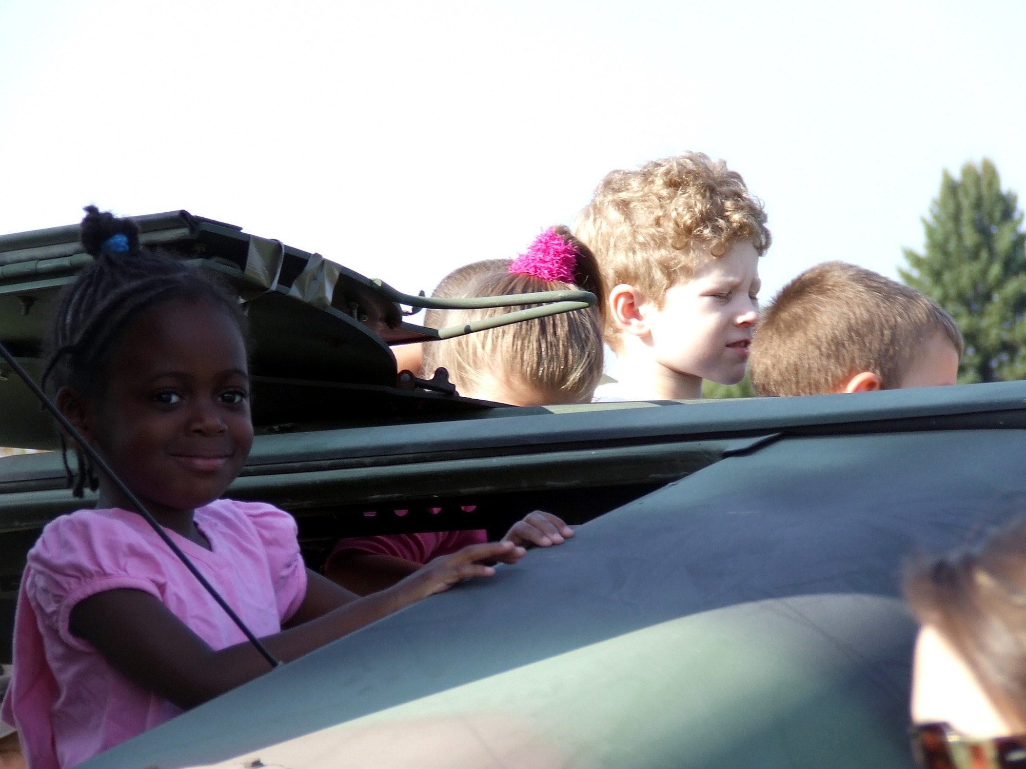 Children from the McGuire Air Force Base, N.J., child development center look out the top of a HMMWV as part of a tactical vehicle display for the children from the U.S. Air Force Expeditionary Center's 421st Combat Training Squadron April 24, 2008.  (U.S. Air Force Photo/Macy Sturkol)
