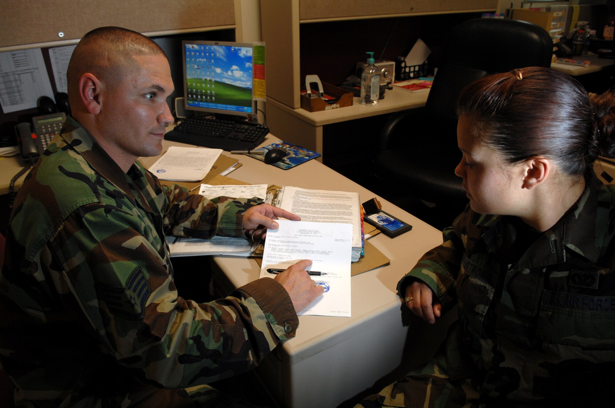 (Left to Right) Staff Sergeant Jason Franklin reviews deployment orders with 
Senior Airman Brandy Armstrong, 49th Civil Engineer Squadron, Apr 22, Holloman Air Force Base, N.M. Sgt. Franklin is the Assistant NCOIC, Installation Personnel Readiness Unit, assigned to the 49th Force Support Squadron.
(U.S. Air Force photo/Senior Airman Anthony Nelson Jr)