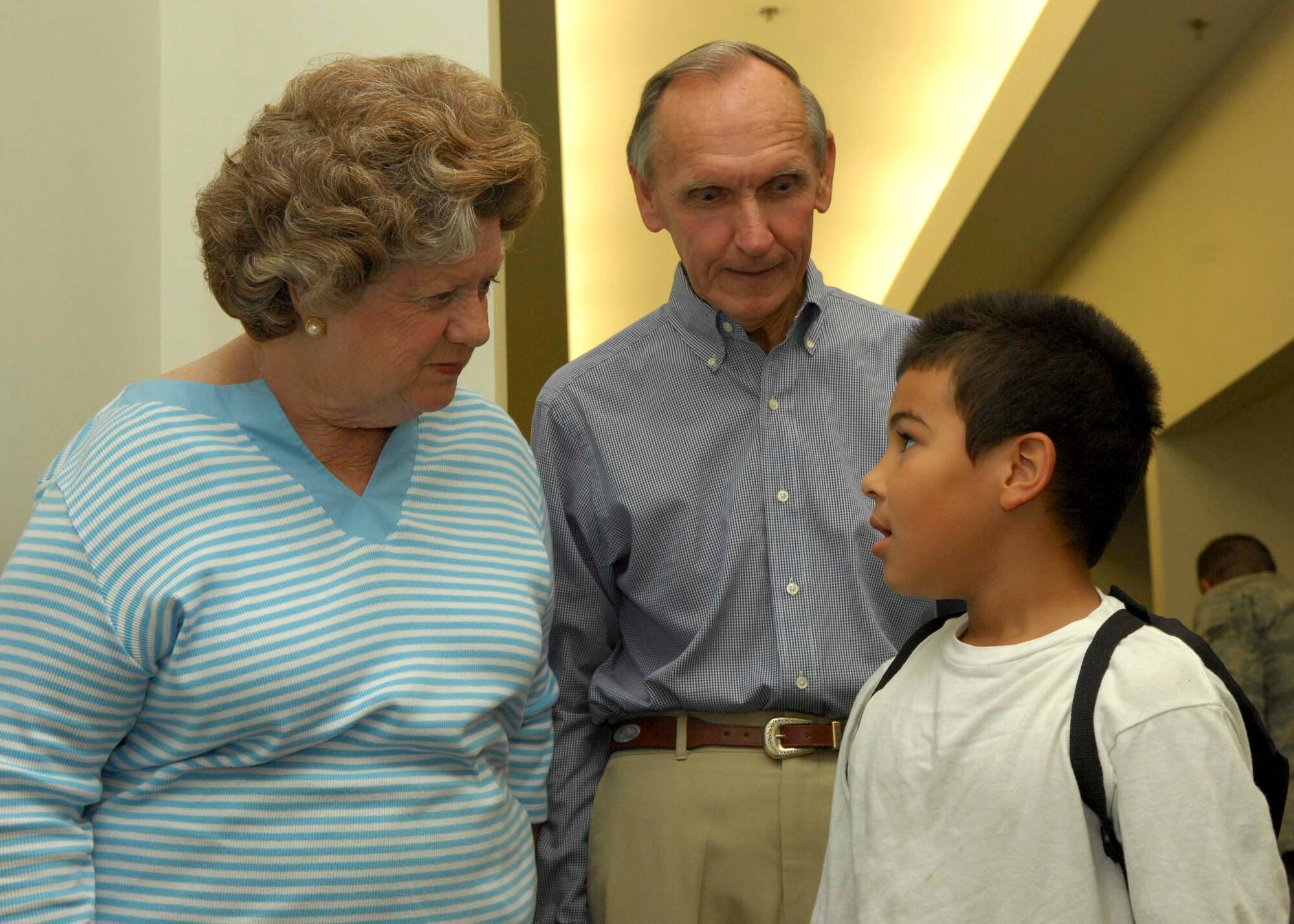 SHAW AIR FORCE BASE, S.C.-- Anna and Archie Chandler talk with Gabriel Fraley, son of Staff Sgt. Sharana Fraley, about his deployment experience during the kids deployment processing line April 24. The kids deployment line gives children of military members a chance to experience what parents go through prior to deployment. (U.S. Air Force photo/Staff Sgt. Henry Hoegen)