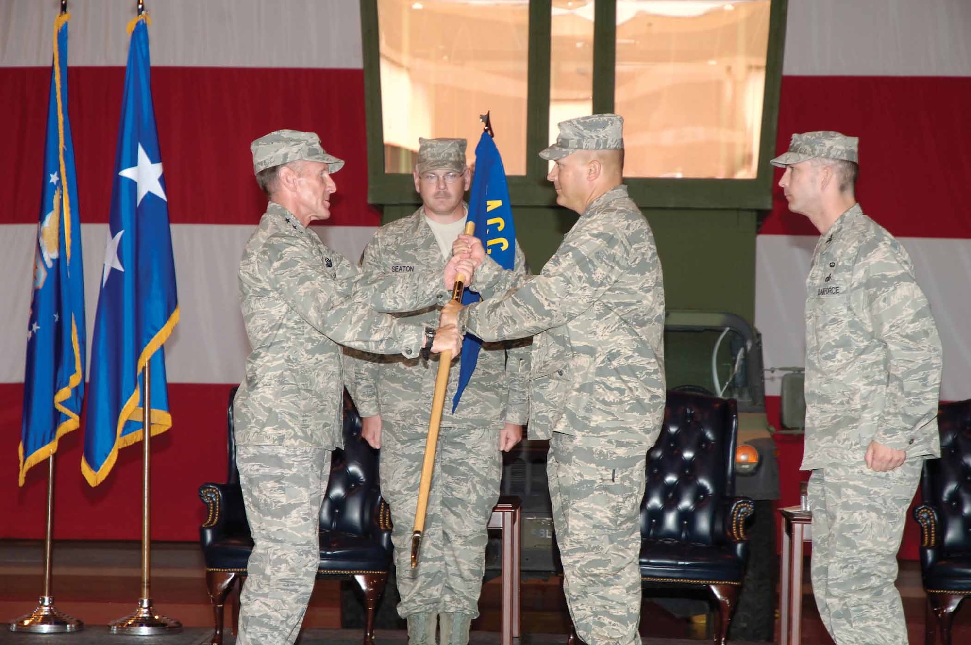 The 3rd Combat Communications Group Airmen got a new commander April 21 in a traditional ceremony set against a backdrop of combat communications heavy equipment.  Col. Thomas Byrge Jr. is given command of The Herd by Lt. Gen. Norman Seip, 12th Air Force commander from Davis-Monthan Air Force Base, Ariz.  Group superintendent Chief Master Sgt. Don Seaton assists with the ceremony.   Outgoing commander, Col. James Appleyard Jr. retired the next day.  (Air Force photo by Kelly White)
 
