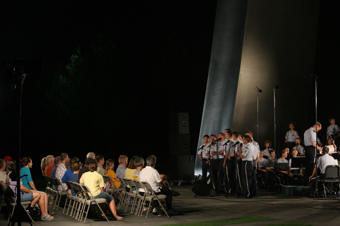 The Men's Chorus of the Singing Sergeants perform with the USAF Concert Band at the Air Force Memorial in August 2007. During the summer months, different components of the USAF Band provide free public concerts at the base of the Air Force Memorial in Arlington, Va. (Official Air Force photo by Senior Master Sgt. Robert Mesite)
