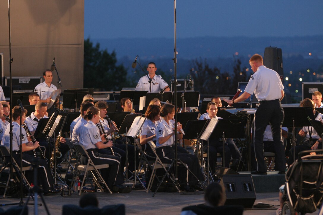 Captain Michael Murray conducts the USAF Concert Band at the Air Force Memorial in August 2007. During the summer months, different components of the USAF Band provide free public concerts at the base of the Air Force Memorial in Arlington, Va. (Official Air Force photo by Senior Master Sgt. Robert Mesite)