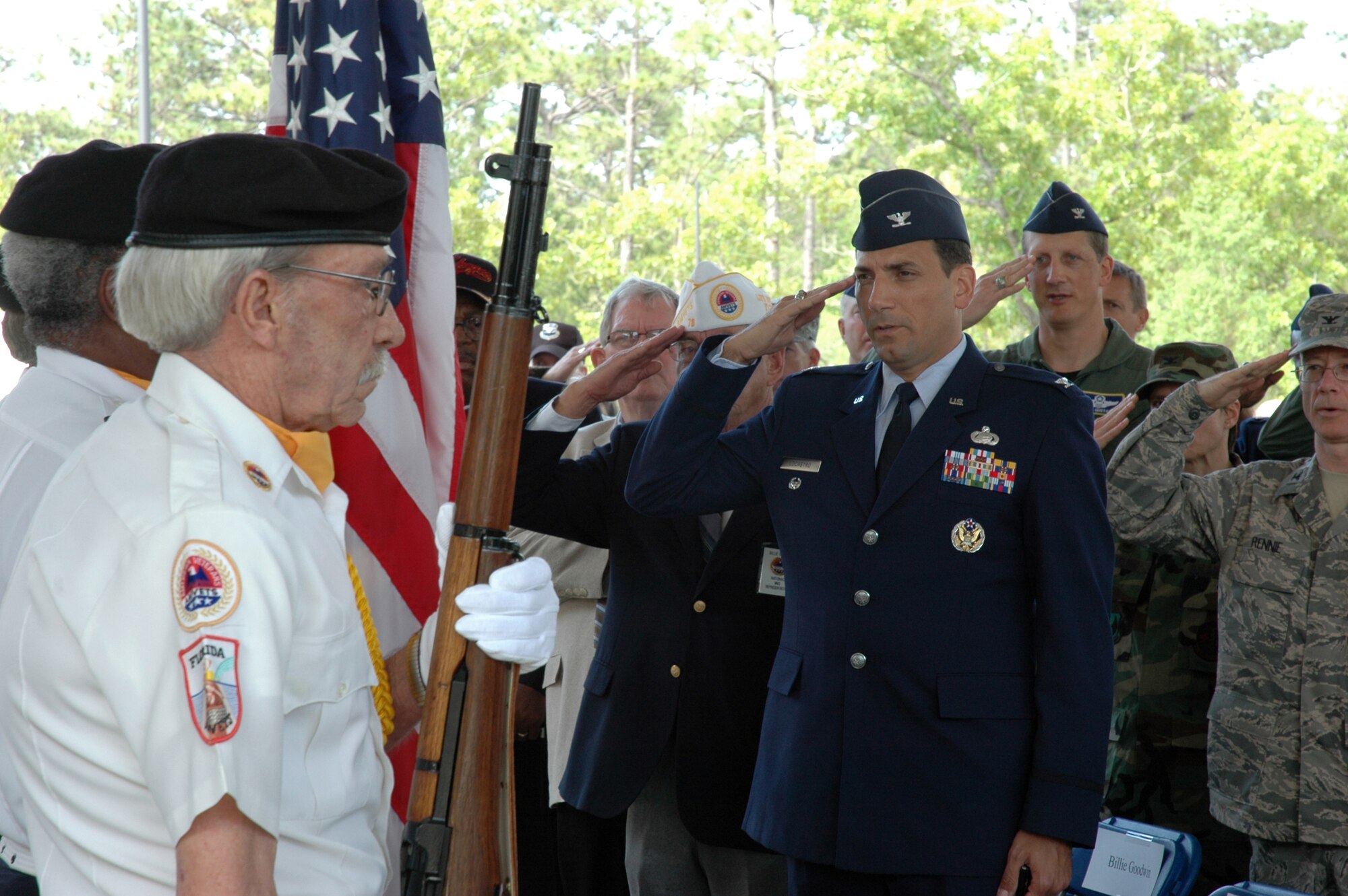 EGLIN AIR FORCE BASE, Fla. -- Col. Rick LoCastro, 96th Air Base Wing Vice Commander, salutes the American flag as the American Veterans Post 78 Color Guard post the colors at the VA Eglin Community-based Outpatient Clinic opening ceremony April 25. (U.S. Air Force photo/Staff Sgt. Stacia Zachary)