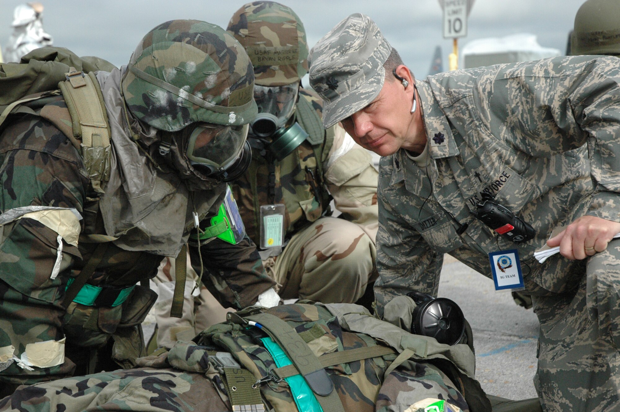 GULFPORT COMBAT READINESS TRAINING CENTER, Miss. -- Lt. Col. John Ditter, a member of the HQ Air Mobility Command Inspector General Team listens closely as an Airman explains how he would treat a casualty during the 910th Airlift Wing's Operational Readiness Inspection. U.S. Air Force photo/Tech. Sgt. Chris Stagner.