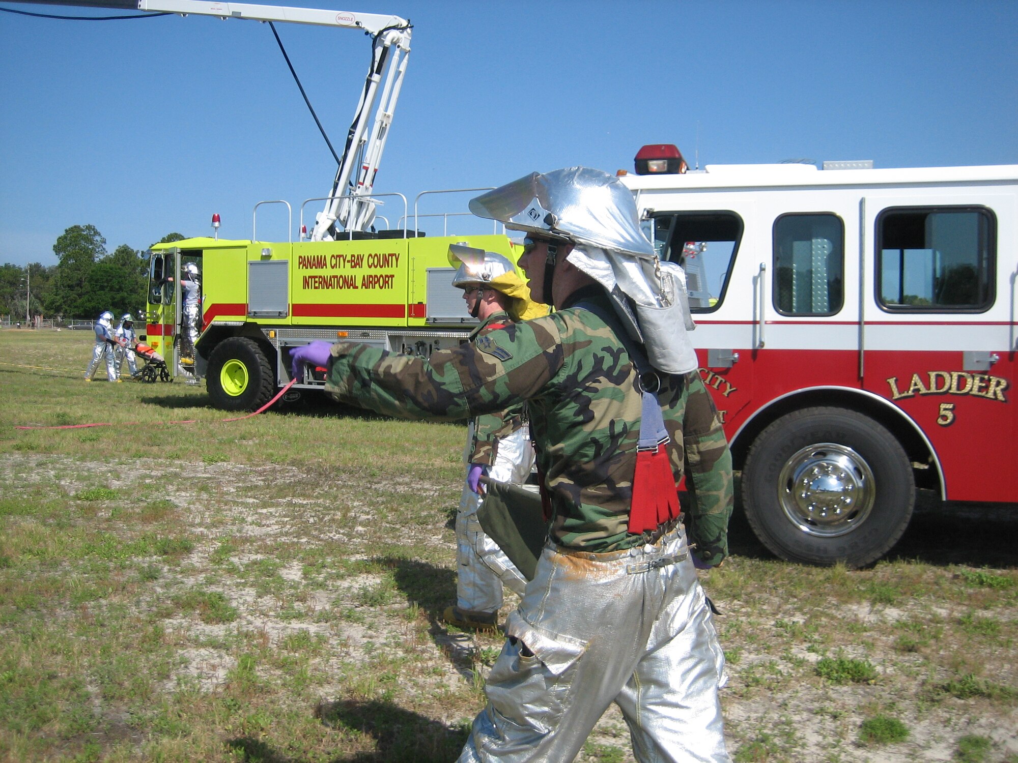 Fire protection specialists from the 325th Civil Engineer Squadron evaluate victims and begin triage during a joint training exercise April 25 at the Panama City Airport. Tyndall fire fighters and medical personnel participated in the training exercise with Bay County emergency response agencies.