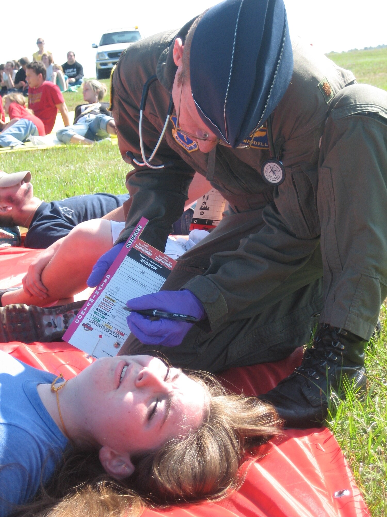 Maj. Craig Wardell, 325th Aeromedical-Dental Squadron flight surgeon, responds to an injured victim during a training exercise April 25 at the Panama City Airport. Tyndall fire fighters and medical personnel participated in the training exercise with Bay County emergency response agencies.