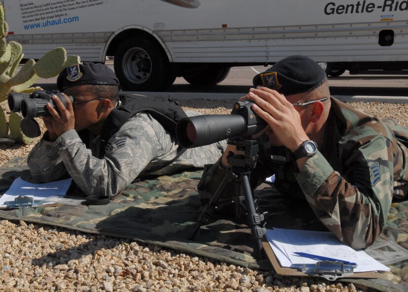 Staff Sgt. Anthony Quinn, a patrolman from the 56th Security Forces Squadron and Senior Airman Benny Prescott, a 56th SFS desk sergeant, train on Target Detection and Sketching to prepare them for Close Precision Engagement training on April 3. (U.S. Air Force photo/Airman 1st Class Gustavo Gonzalez)