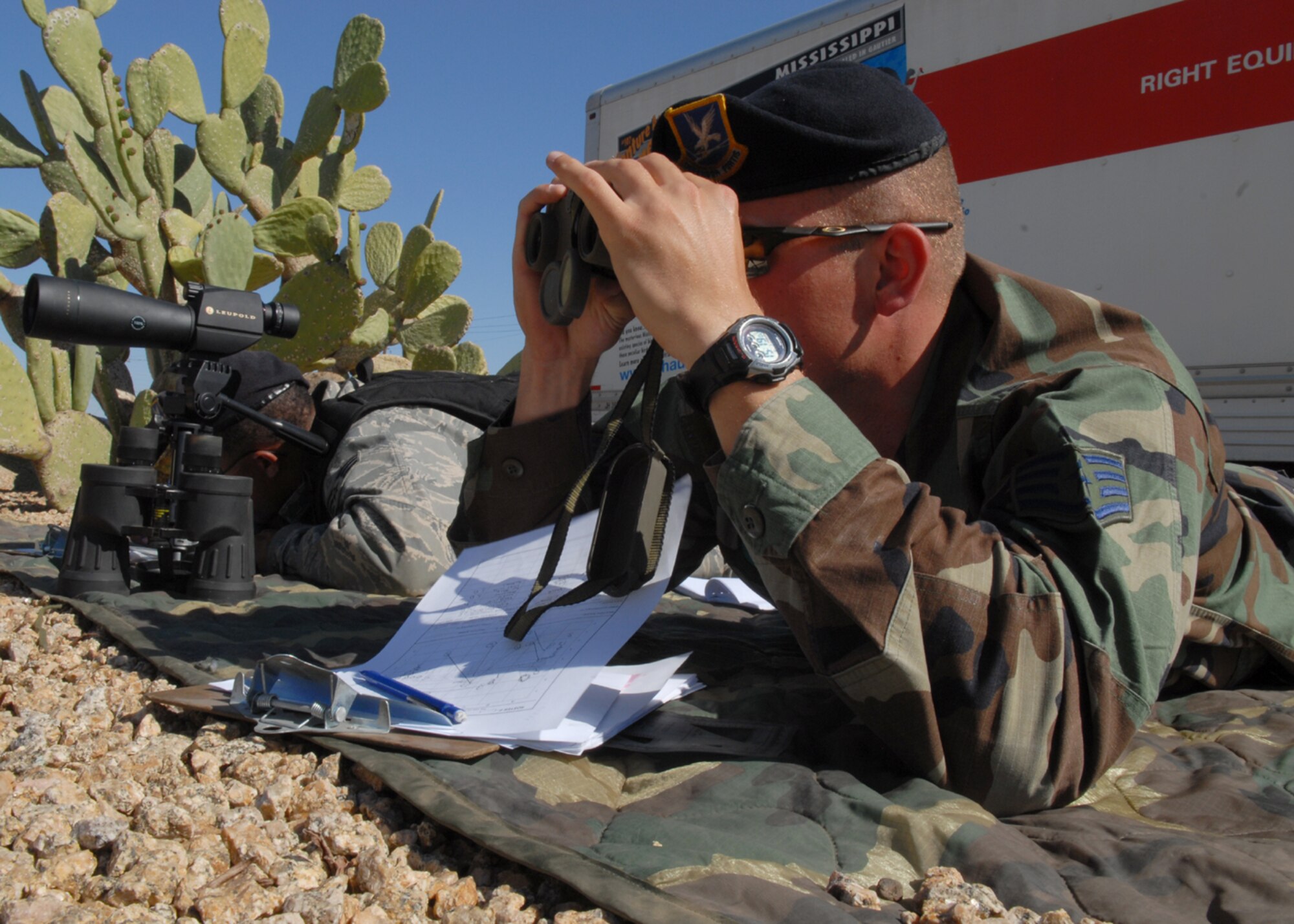 Staff Sgt. Anthony Quinn, a patrolman from the 56th Security Forces Squadron and Senior Airman Benny Prescott, a 56th SFS desk sergeant, train on Target Detection and Sketching to prepare them for Close Precision Engagement training on April 3. (U.S. Air Force photo/Airman 1st Class Gustavo Gonzalez)