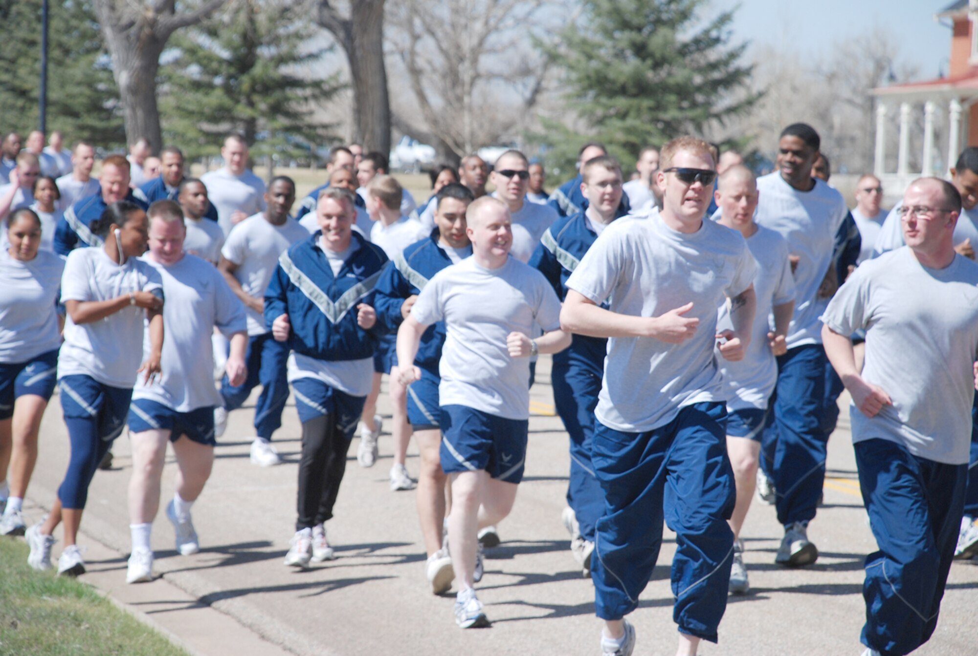 Nearly 200 Warren Airmen participate in the 5K wing run Tuesday near Warren’s Airmen and Family Readiness Center. This was the first wing run of 2008. The group began by stretching, then completing one minute of push-ups and one minute of sit-ups before they ran the course (U.S. Air Force photo/Staff Sgt. Chad Thompson).

