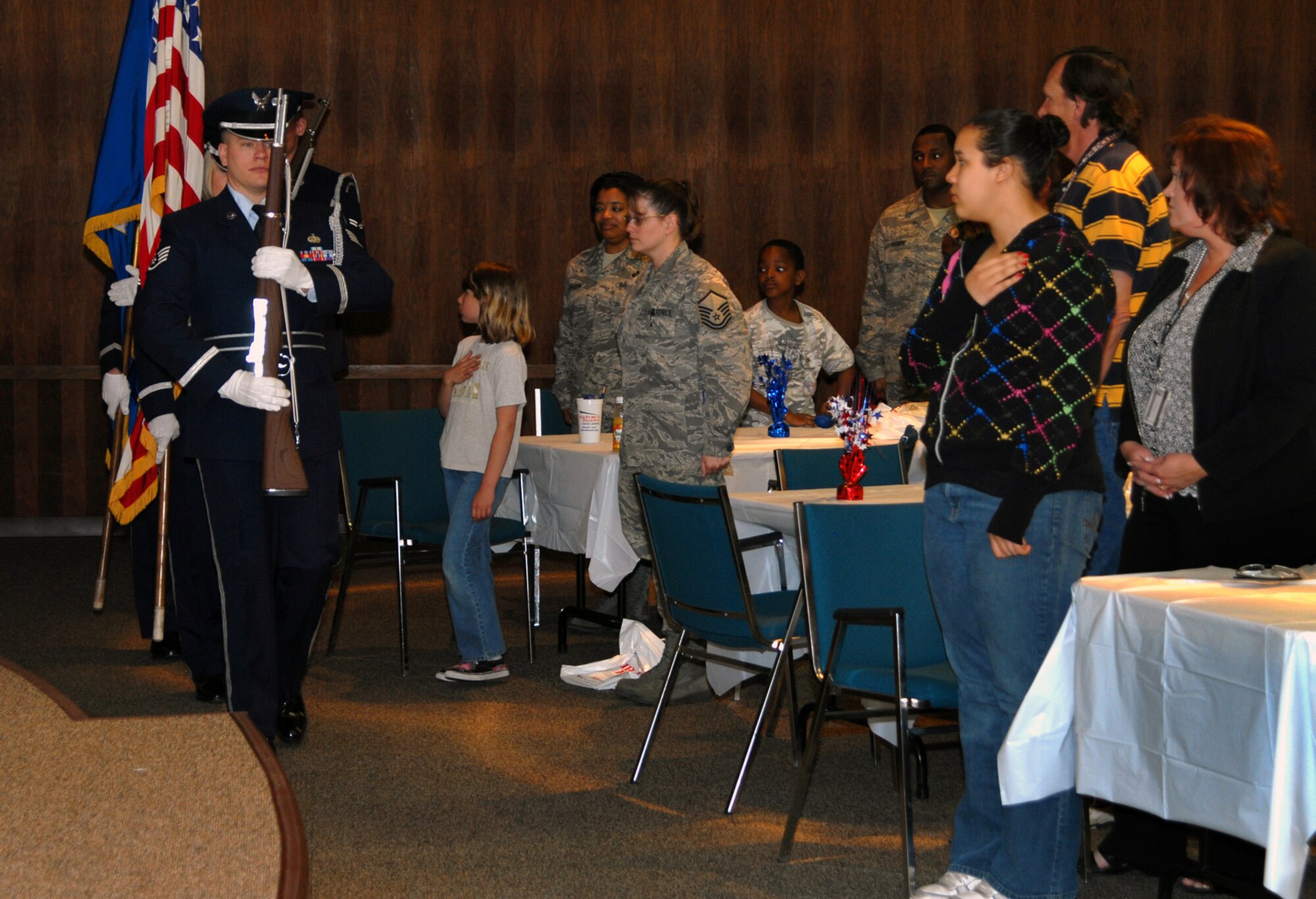 The Air Reserve Personnel Center honor guard presents the colors during Bring Your Child to Work Day at ARPC on April 24. The children and their parents received a kids' version of the ARPC mission brief, skits about good and bad customer service, and a virtual tour of the ARPC Web site. (U.S. Air Force photo/Ellen Edwards)