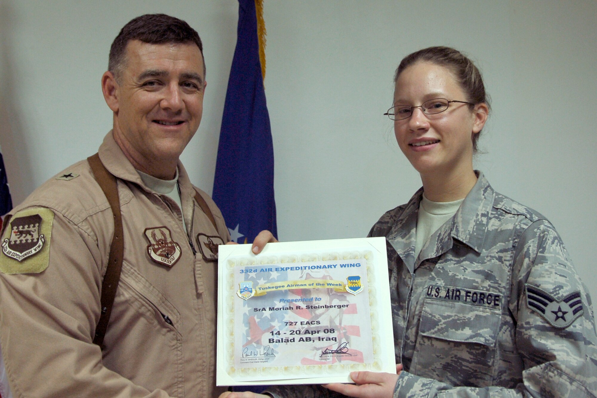 Brig. Gen. Burt Field, the 332nd Air Expeditionary Wing commander, recognizes Senior Airman Moriah Steinberger, a 727th Expeditionary Air Control Squadron aerospace control and warning systems operator, as the Tuskegee Airman of the Week for April 14 - 20. Airman Steinberger, who is deployed from Eglin Air Force Base, Fla., was selected from more than 8,000 Airmen in the 332nd AEW for her on and off-duty accomplishments. Airman Steinberger is the only Airman of 77 who is qualified as an electronic protection, data systems and systems technician while managing 122 operations training files spanning 11 duty positions. She optimized two radars and validated 12 Periodic Radar Evaluation Program height checks ensuring alternate safety of more than 10,000 military and civilian flights. Airman Steinberger also led six database air tasking order changes to the new Battle Control Center-AFCENT system making a seamless transition for the warfighter. In her off-duty time she instructed spinning classes at the fitness center four nights a week and earned 12 credits toward her Community College of the Air Force and bachelor's degrees. She volunteered six hours at the United Services Organization; helped collect 50 lbs. of items to send to coalition forces in austere locations and sang the National Anthem at the Air Expeditionary Forces rotation 1/2 Dining In. The 332 AEW traces its heritage to World War II and the Tuskegee Airmen of the 332nd Fighter Group.