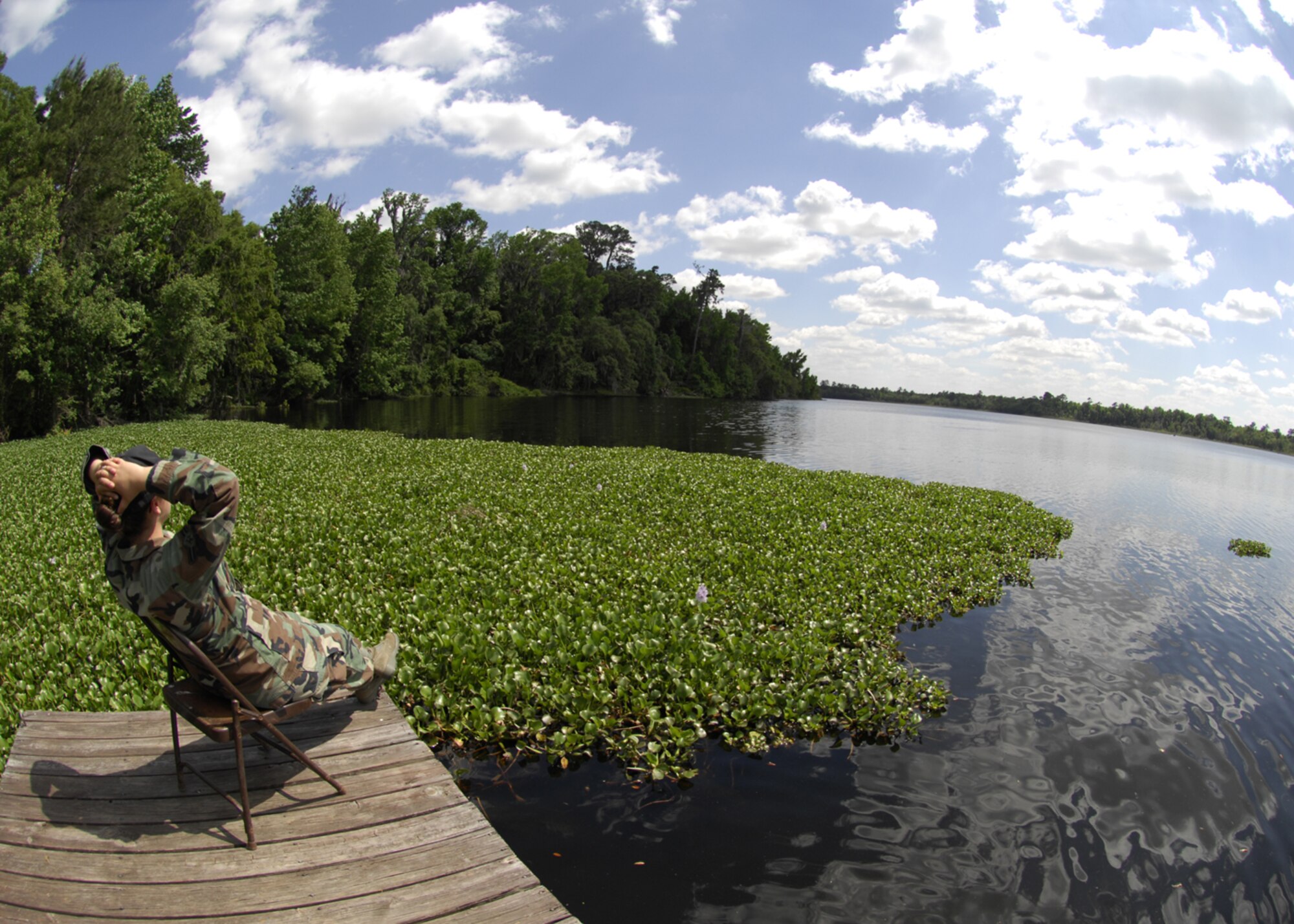 MOODY AIR FORCE BASE, Ga. -- An Airman from Moody Air Force Base relaxes at Grassy Pond April 23. Grassy Pond is a recreational area open to active duty and retired military personnel of all services, Coast Guard personnel, Department of Defense civilian employees, retired DoD civilian employees, Nonappropriated Fund employees and their dependents. (U.S. Air Force Photo by Senior Airman Elizabeth Rissmiller) 