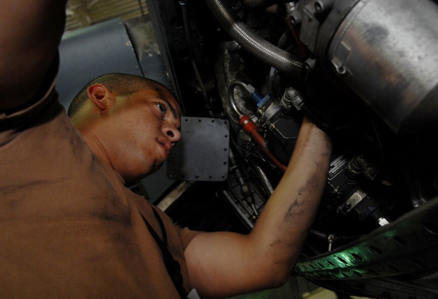 MOODY AIR FORCE BASE, Ga. --  Airman 1st Class Anthony Brown, 23rd Component Maintenance Squadron aerospace propulsion apprentice, works on a bleed air hose on a HC-130P King here April 21. The aircraft is brought in for thorough inspections after every 400 flying hours to verify the health of every aspect of the aircraft. (U.S. Air Force photo by Senior Airman Gina Chiaverotti)