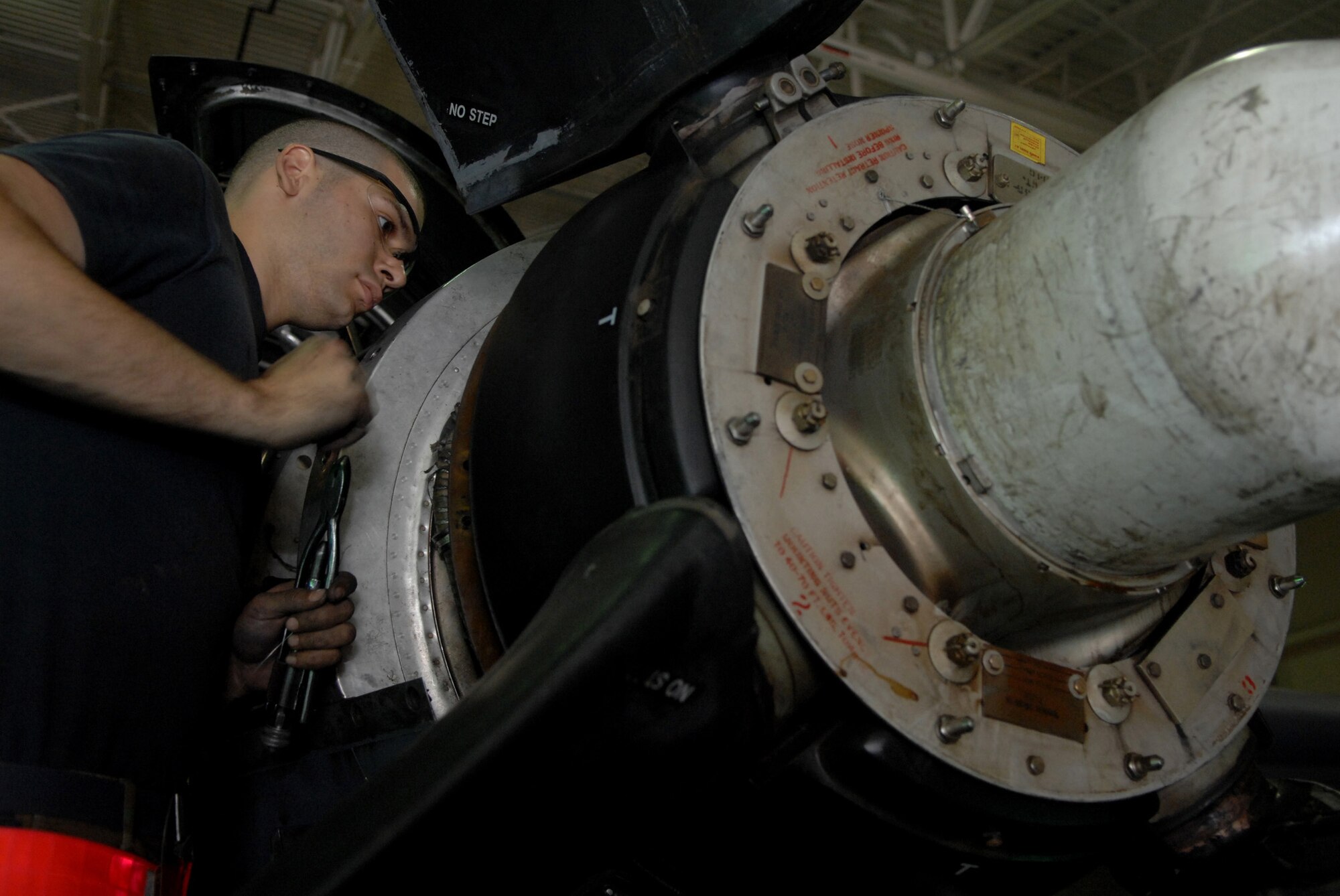 MOODY AIR FORCE BASE, Ga. -- Airman 1st Class Joseph Muscarella, 23rd Component Maintenance Squadron aerospace propulsion journeyman, works on a T-56 turboprop engine on a HC-130P King here April 21. The rescue aircraft has four of the engines and undergo regular maintenance to keep the aircraft mission ready.(U.S. Air Force photo by Senior Airman Gina Chiaverotti) 