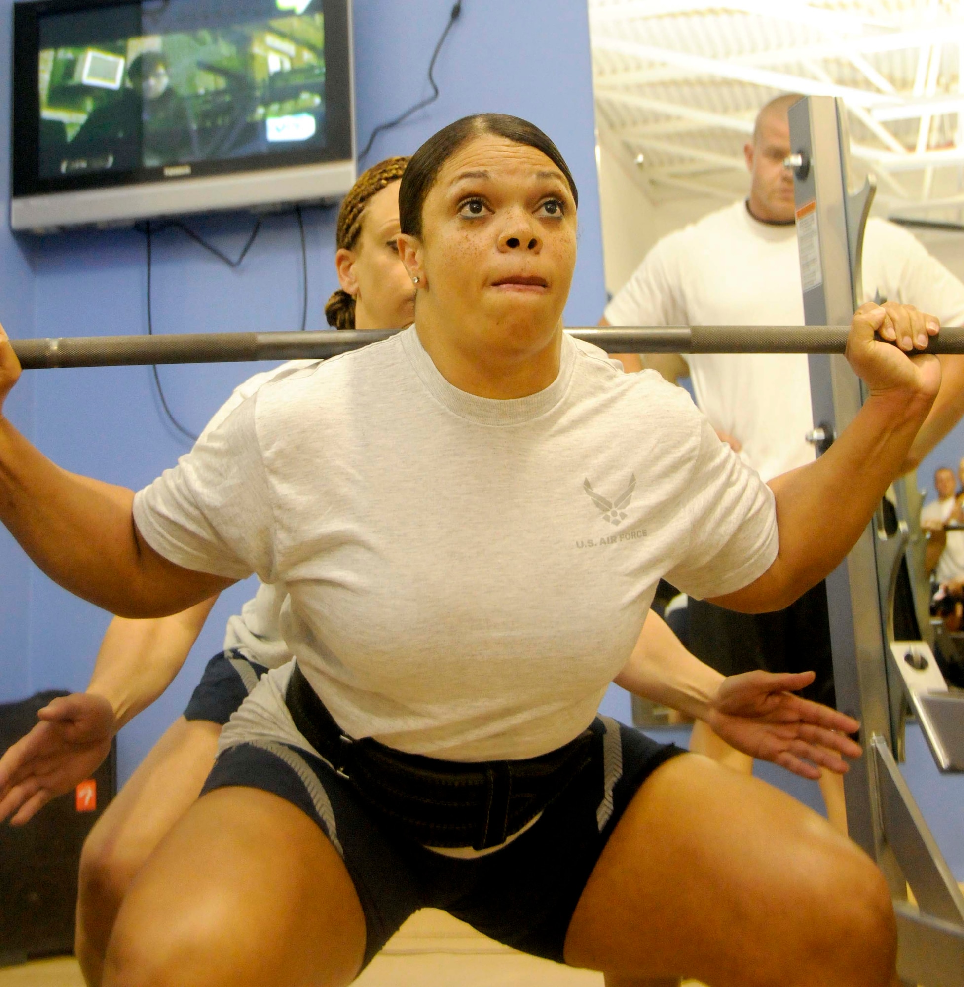 Master Sgt. Tina Robinson squats 300 pounds March 29 at the Blatchford-Preston Complex fitness center. After placing first in the women’s category here by squatting 300 pounds and bench pressing 250 pounds, her scores went up to compete against the best scores from five other bases in the area. A total of 38 Airmen competed in the AFCENT AOR, including five women, and Sergeant Robinson took top honors. (U.S. Air Force photo by Senior Airman Domonique Simmons)