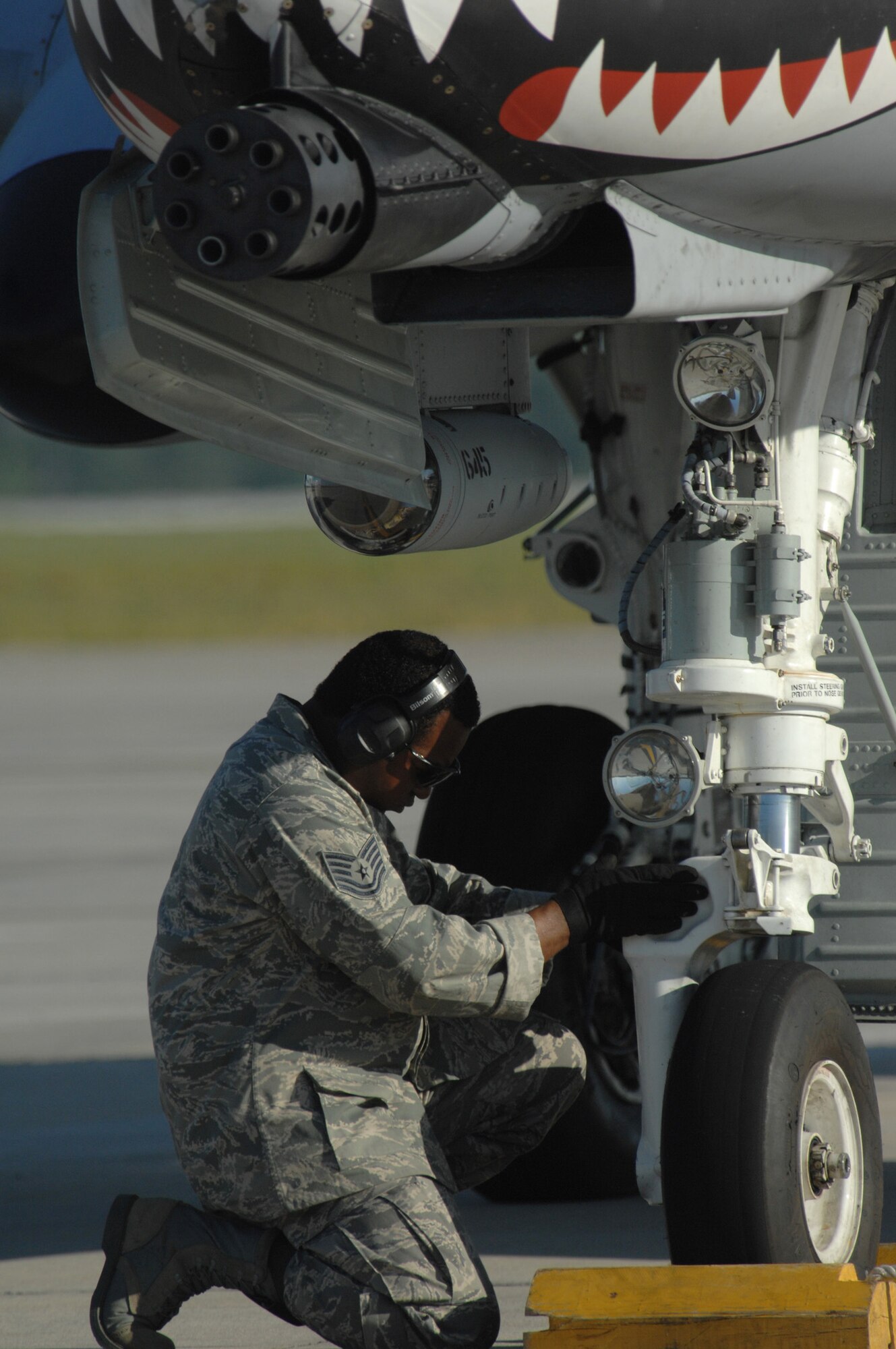MOODY AIR FORCE BASE, Ga. -- Tech. Sgt. Kelvin Moody, 23rd Aircraft Maintenance Squadron end of runway superintendent, checks the landing gear on an A-10C Thunderbolt II during end of runway operations here April 17. (U.S. Air Force photo by Senior Airman Gina Chiaverotti) 