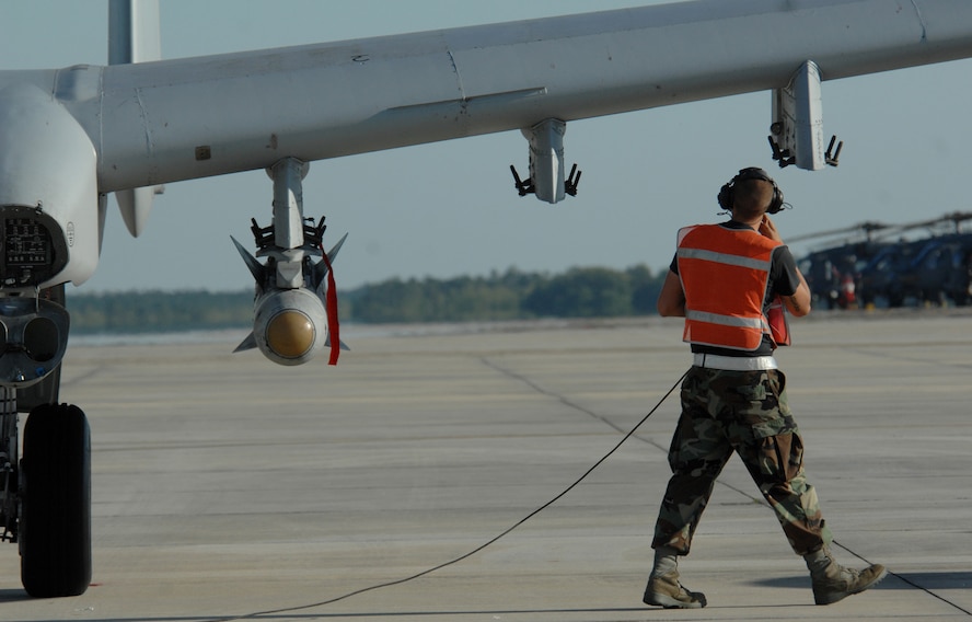 MOODY AIR FORCE BASE, Ga. -- Airman 1st Class Joseph Blount, 23rd Aircraft Maintenance Squadron crew chief, does one last check on an A-10C Thunderbolt II during end-of-runway operations here April 17. End-of-runway inspections are done each time the aircraft leaves for, and returns from, a sortie. (U.S. Air Force photo by Senior Airman Gina Chiaverotti) (Released)
