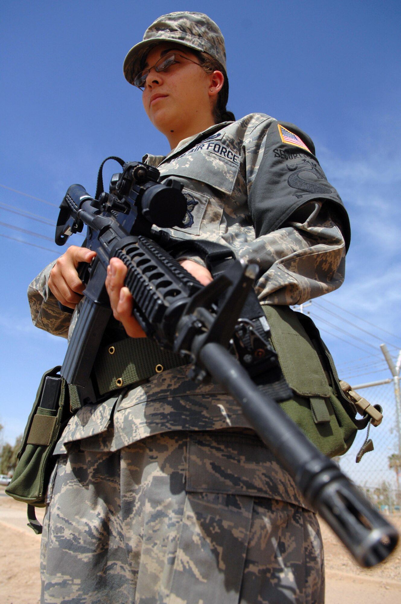 Airman 1st Class Tasha Gonzalez stands alert April 18 at an entry control point at Balad Air Base, Iraq. Constant vigilance ensures security of airpower assets and personnel. Airman Gonzalez is deployed from Luke Air Force Base, Ariz. (U.S. Air Force photo/ Senior Airman Julianne Showalter)
