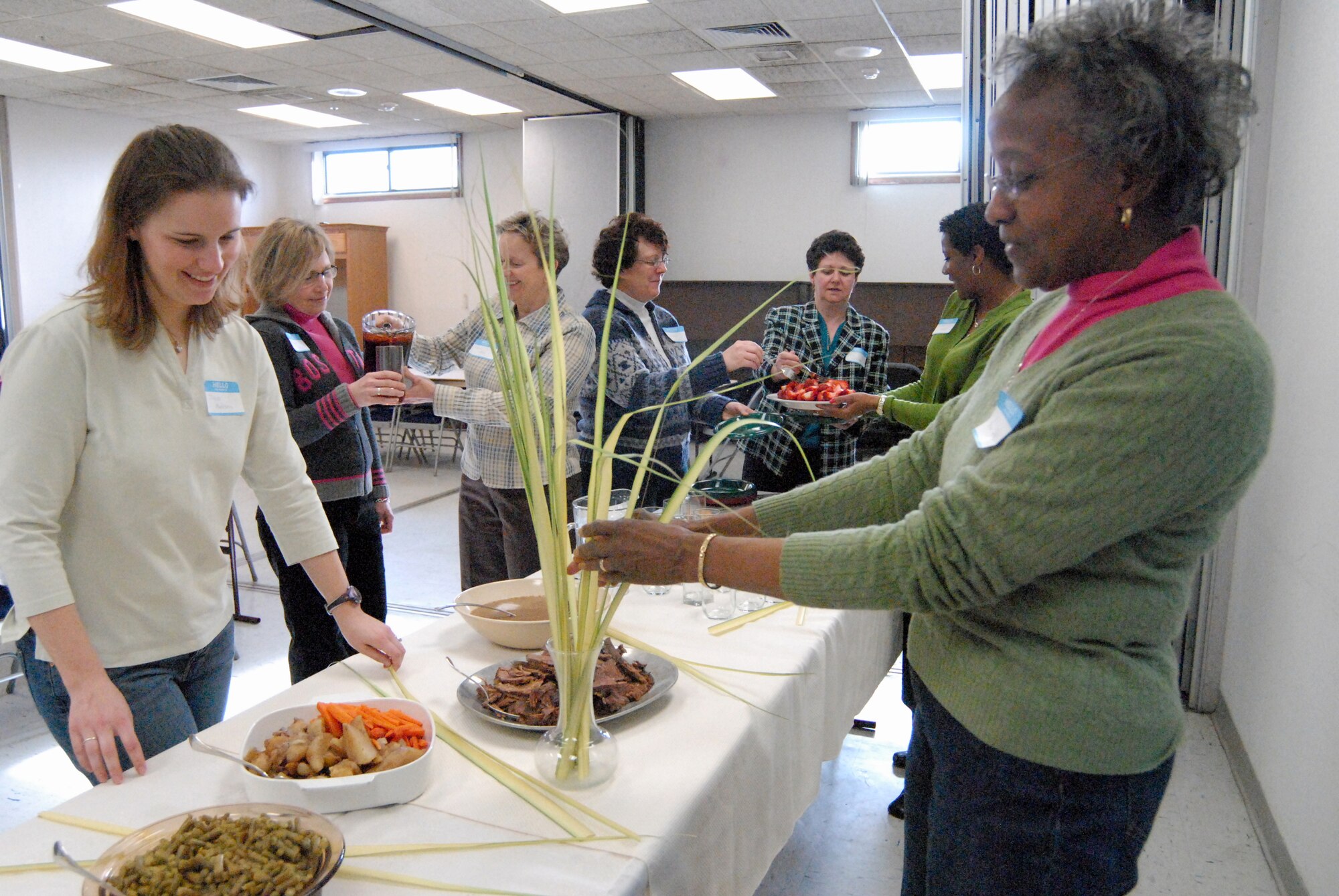 (Right) Vera Bell, a Chapel volunteer for 15 years at Dover Air Force Base and head coordinator for the Home Making 101 program, decorates and prepares the finishing touches for the meeting’s meal. (U.S. Air Force photo/Airman 1st Class Shen-Chia Chu)
