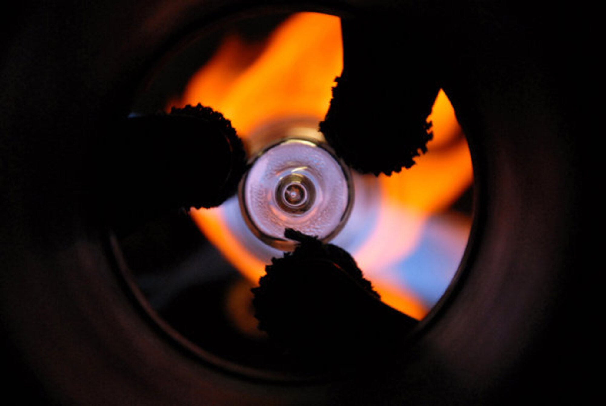 A dramatic photo from a Cambridge speciality glass blower.  Staff Sgt. Rich like most military photographers is passionate about her profession and seeks opportunities to test and improve her skills.  This shoot was for professional development and training in complex lighting situations.  (U.S. Air Force photo by Staff Sgt. Jocelyn L. Rich) 