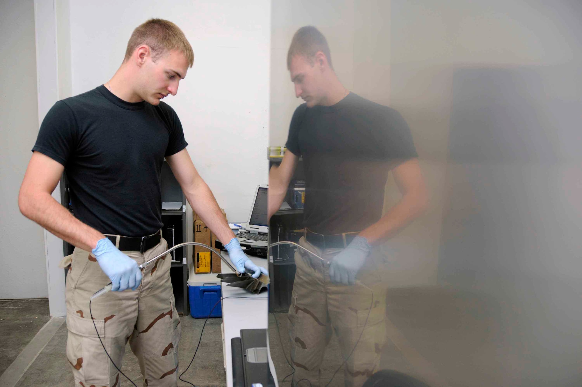 SOUTHWEST ASIA – Senior Airman Trevor Knapp, 379th EMXS NDI specialist, probes a fan blade with an ultrasonic unit to detect any possible damage to a B-1 engine. Airman Knapp probes each fan blade, which can take up to two and a half hours for a whole engine. (U.S. Air Force photo/ Senior Airman Domonique Simmons)