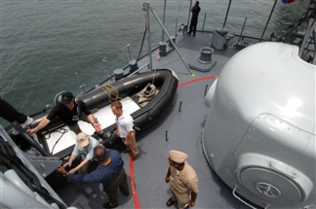 Participants from the 75th Joint Civilian Orientation Conference tour Colombian military naval surface ships during a cultural visit in Cartagena, Colombia, April 23, 2008. 