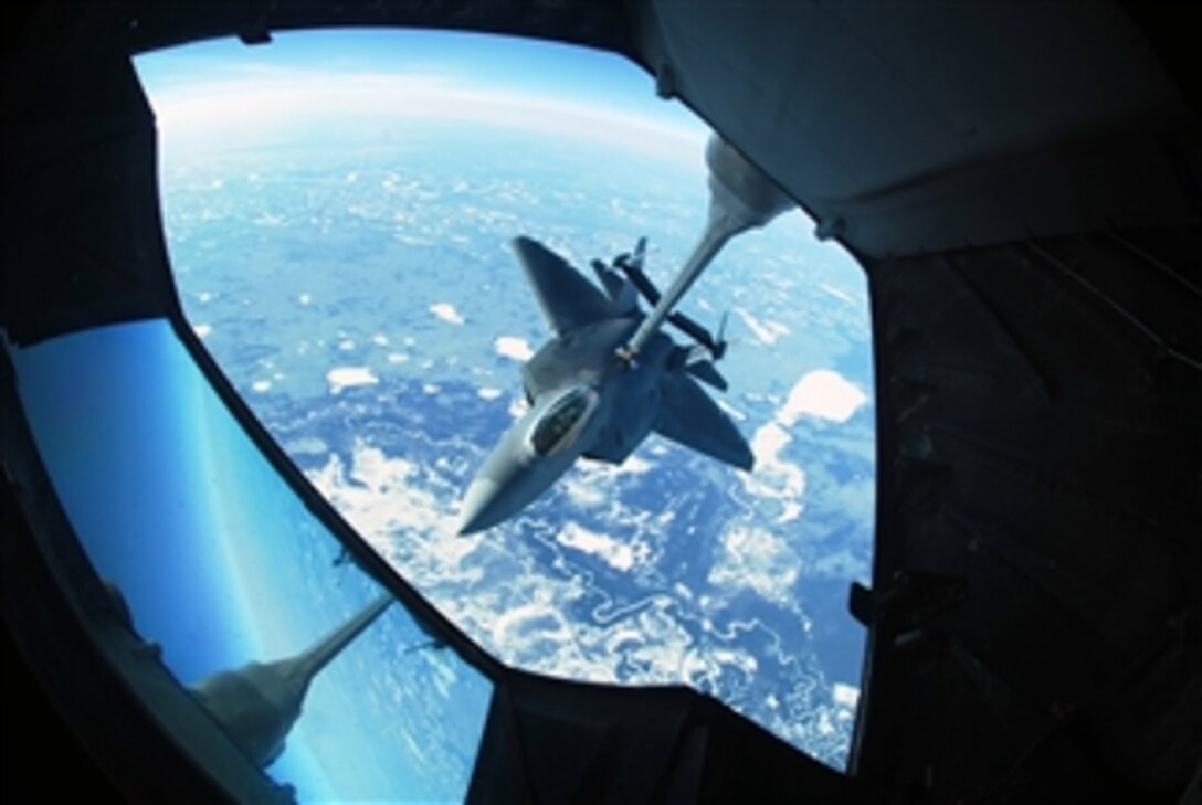 An Air Force F-22 Raptor aircraft takes on fuel from a KC-10 Extender aircraft 26,000 feet above Eielson Air Force Base, Alaska, on April 17, 2008.  The two aircraft and their crews are taking part in Exercise Red Flag - Alaska, a multinational exercise that provides realistic training for combat scenarios.  