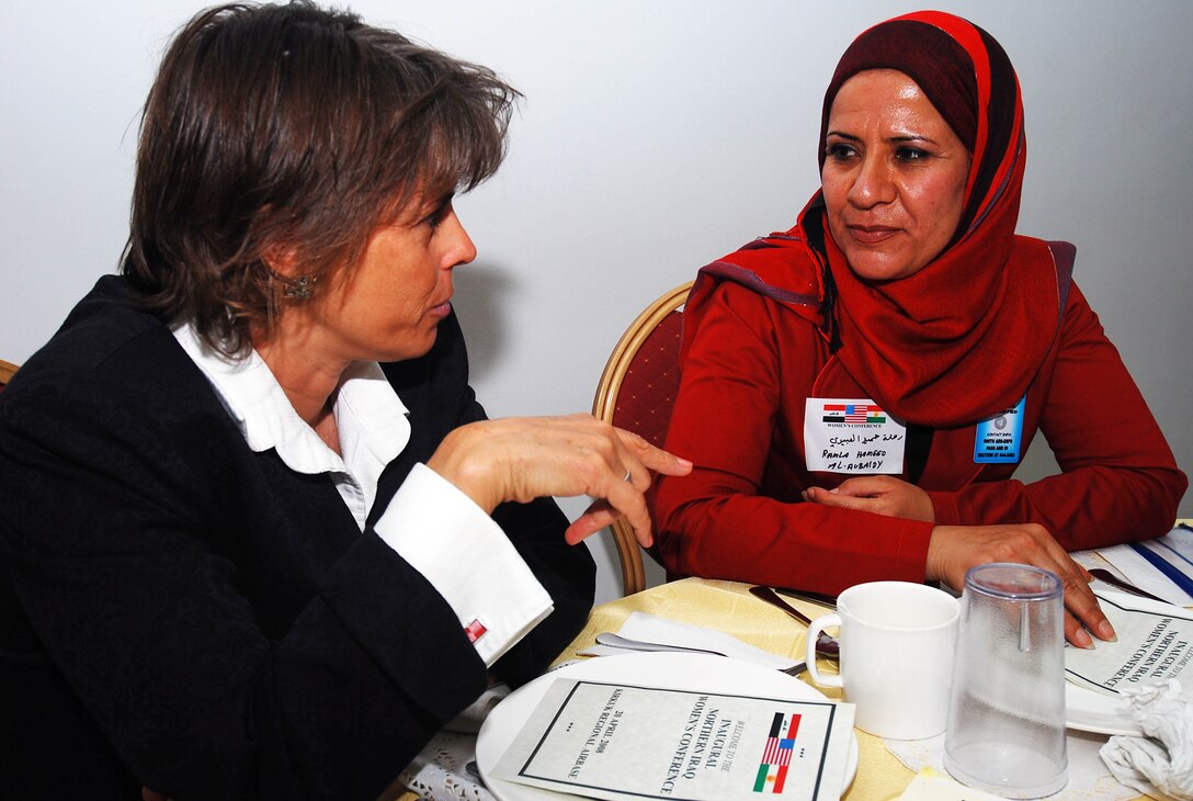 Melissa J. Ward, Kirkuk Provincial Reconstruction Team's Governance Advisor and Ramla Hameed Obedi, Kirkuk Provincial Council Member, discuss issues effecting women in the province at the Inaugural Northern Iraq Women's Conference held at Forward Operating Base Warrior, Kirkuk, Iraq, April 20. (U.S. Army photo by Staff Sgt. Margaret C. Nelson)