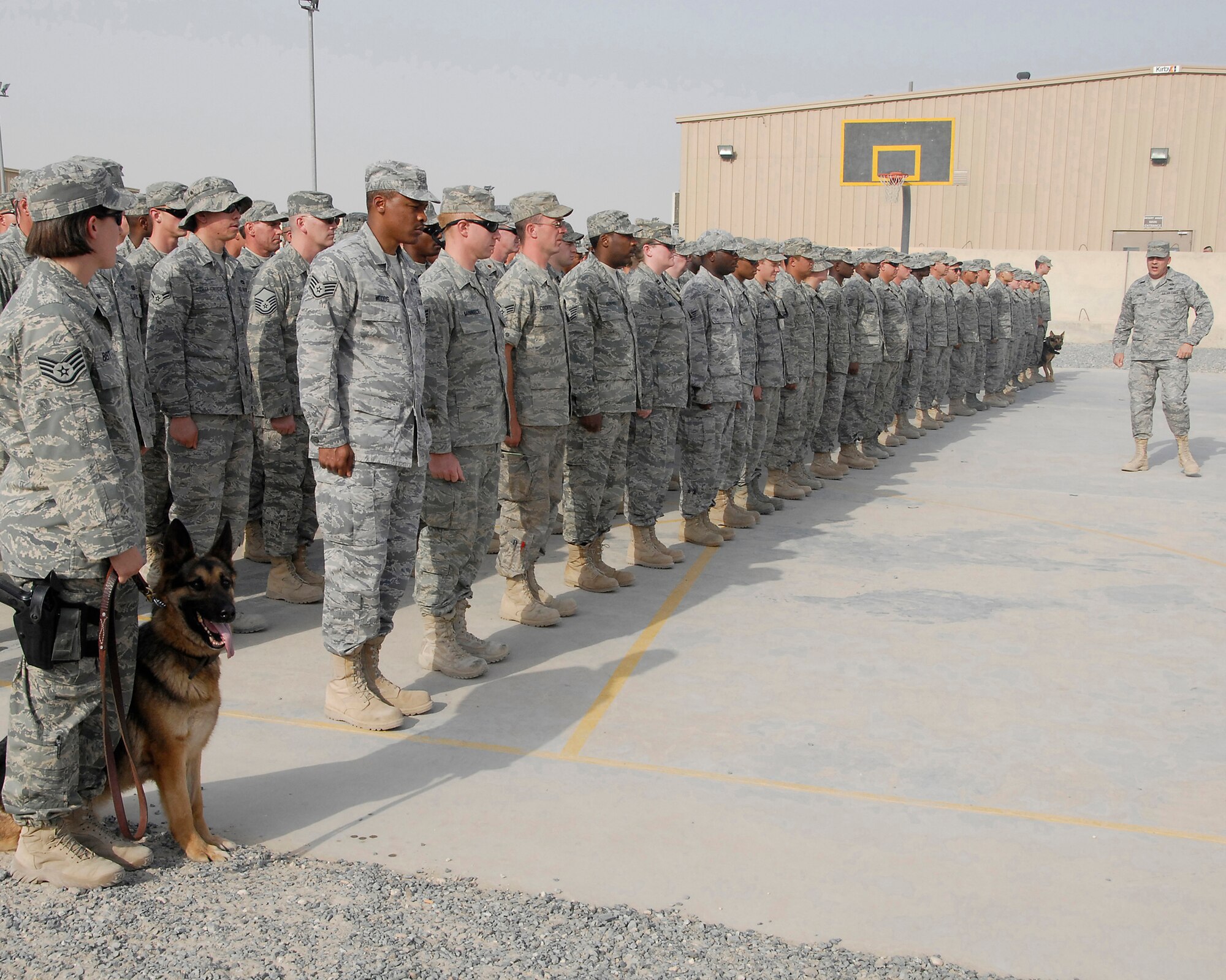 SOUTHWEST ASIA – Senior Master Sgt. Paul Yecke, the first sergeant for the 386th Expeditionary Mission Support Group, uses his basic military training instructor skills to size up a formation of more than 270 Airmen for an expedited retreat ceremony April 25, 2008, at an air base in the Persian Gulf Region. The group paid homage to the American flag. (U.S. Air Force photo/Tech. Sgt. Michael O’Connor)