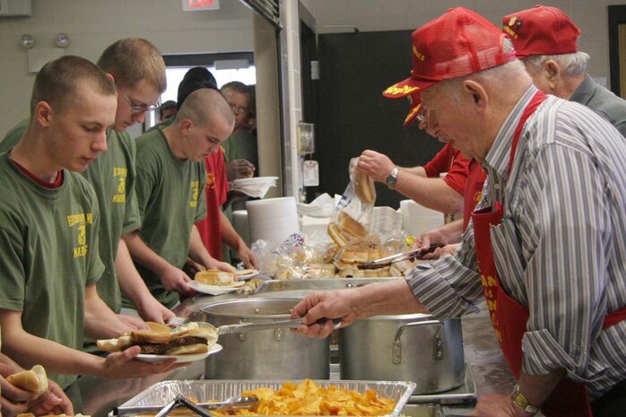 CAMP RIPLEY, Minn.- On the last day of Recruiting Station Twin Cities' Mini-Boot Camp, former and retired Marines from the Twin Cities Metro Marines came out to serve the poolees a well-deserved meal before they departed the training site April 27. Photo by Staff Sgt. Stephen L. Traynham, Recruiting Station Twin Cities