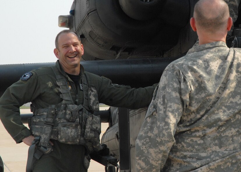 KUNSAN AIR BASE, Republic of Korea— Colonel Creig Rice 8th Fighter Wing vice commander and Chief Warrant Officer 3rd Class Doug Golden 4-2 Attack Battalion from Camp Humphreys, conduct a pre-inspection on a AH-64D Apache helicopter April 28 here.  (U.S. Air Force Photo/Staff Sgt. Araceli Alarcon) 