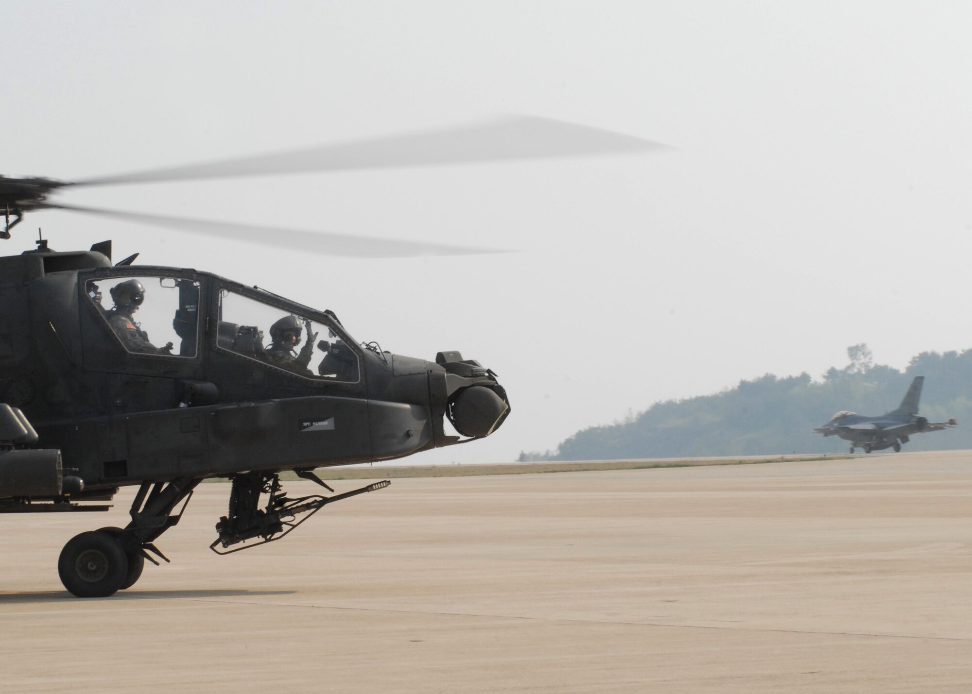 KUNSAN AIR BASE Republic of Korea —  Colonel Creig Rice 8th Fighter Wing vice commander, waves goodbye as he departs April 28 here.  (U.S. Air Force Photo/Staff Sgt. Araceli Alarcon) 