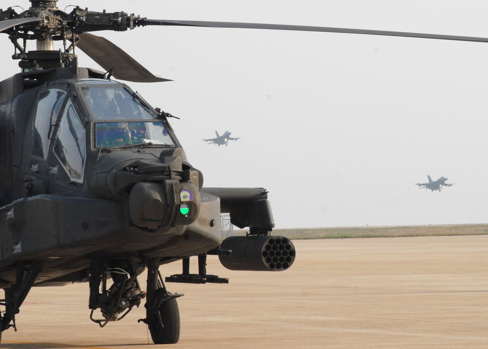 KUNSAN AIR BASE Republic of Korea— Colonel C.Q. “Wolf” Brown 8th Fighter Wing commander, conducts his pre-flight check on a AH-64D Apache helicopter April 28 here. (U.S. Air Force Photo/Staff Sgt. Araceli Alarcon)  