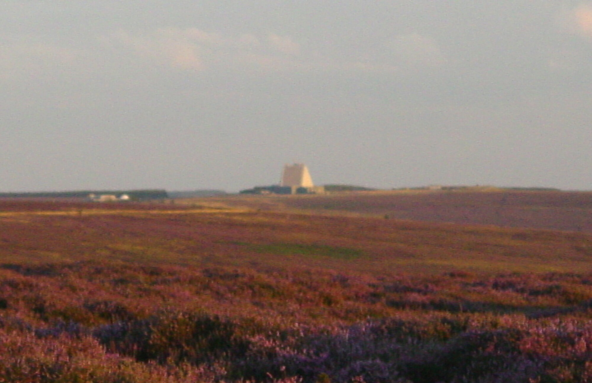 A glimpse overlooking the heather fields outside the town of Sandsend, England, reveal the AN/FPS-120 Phased Array Space Surveillance Radar based at Royal Air Force Fylingdales. Fylingdales was visited by Col. Jay Raymond, 21st Space Wing commander, Chief Master Sgt. Timothy Omdal, 21st SW command chief and Senior Airman Ricardo Woods for a site visit of Fylingdales and the installation’s sister unit at RAF High Wycombe, located outside London. Both installations make up the U.K. Missile Warning Center that maintains a continuous missile warning capability for the U.S. and United Kingdom. Sandsend is 258 miles north of London. (Courtesy photo) 
