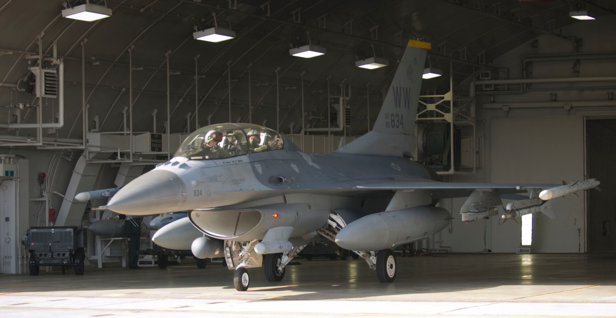 MISAWA AIR BASE, Japan -- An F-16, piloted by Lt. Col. Stephen Williams, 13th Fighter Squadron commander, exits the hangar on April 15, 2008. Colonel Williams was giving a familiarization flight to Maj. Gen. Hideo Wakabayashi, Japan Air Self Defense Force 3rd Air Wing commander, to promote understanding between American and Japanese forces in Japan. (U.S. Air Force photo by Senior Airman Samuel Morse)

