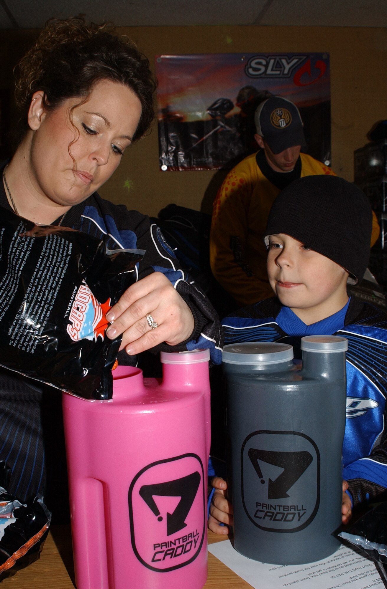 Jamie Smith and her 8-year old son, Tyler, fill pod tanks with paintballs in preparation for Outdoor Recreation’s Spring Thaw Paintball Tournament in Hangar 1700 Saturday. The Great Falls Police Department and the Enforcing Underage Drinking Laws (EUDL) program co-sponsored the free paintball tournament and burger burn at Malmstrom. Fourteen five-person teams took part in the competition with one team coming from as far away as Chinook, Mont. Team Nightmare took first place and consisted of Mike Stevens, Devin Banks, Matt Stevens, Caleb Bliesner and Danny Campbell. (U.S. Air Force photo/Staff Sgt. Marcus McDonald)