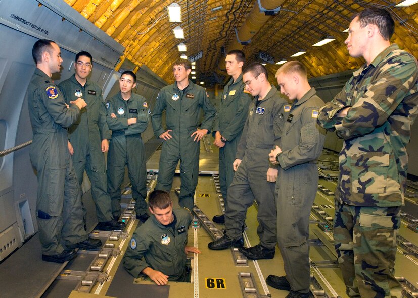 Left: KC-10 Extender Pilot Captain Michael Garrott of the 9th Air Refueling Squadron speaks with Air Force Academy Cadets about the KC-10's mission as they tour the aircraft.  The Air Force Cadets experience at Travis Air Force Base, California was highlighted by getting to talk personally to Travis Team members in their areas of expertise.  USAF photo by Civ/Nan Wylie
